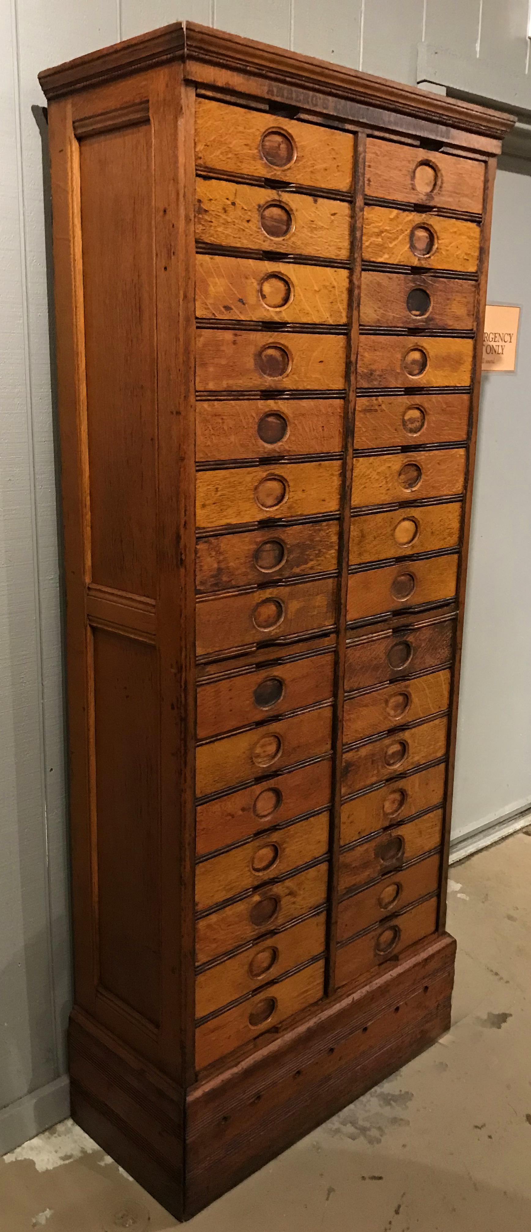 A wonderful thirty drawer cabinet in oak labeled on the top front “Amberg’s Cabinet Letter File” with interior labels which read “Amberg’s Imperial Letter File” by the Amberg Letter & Index Co, London, New York, Chicago,” originally patented in