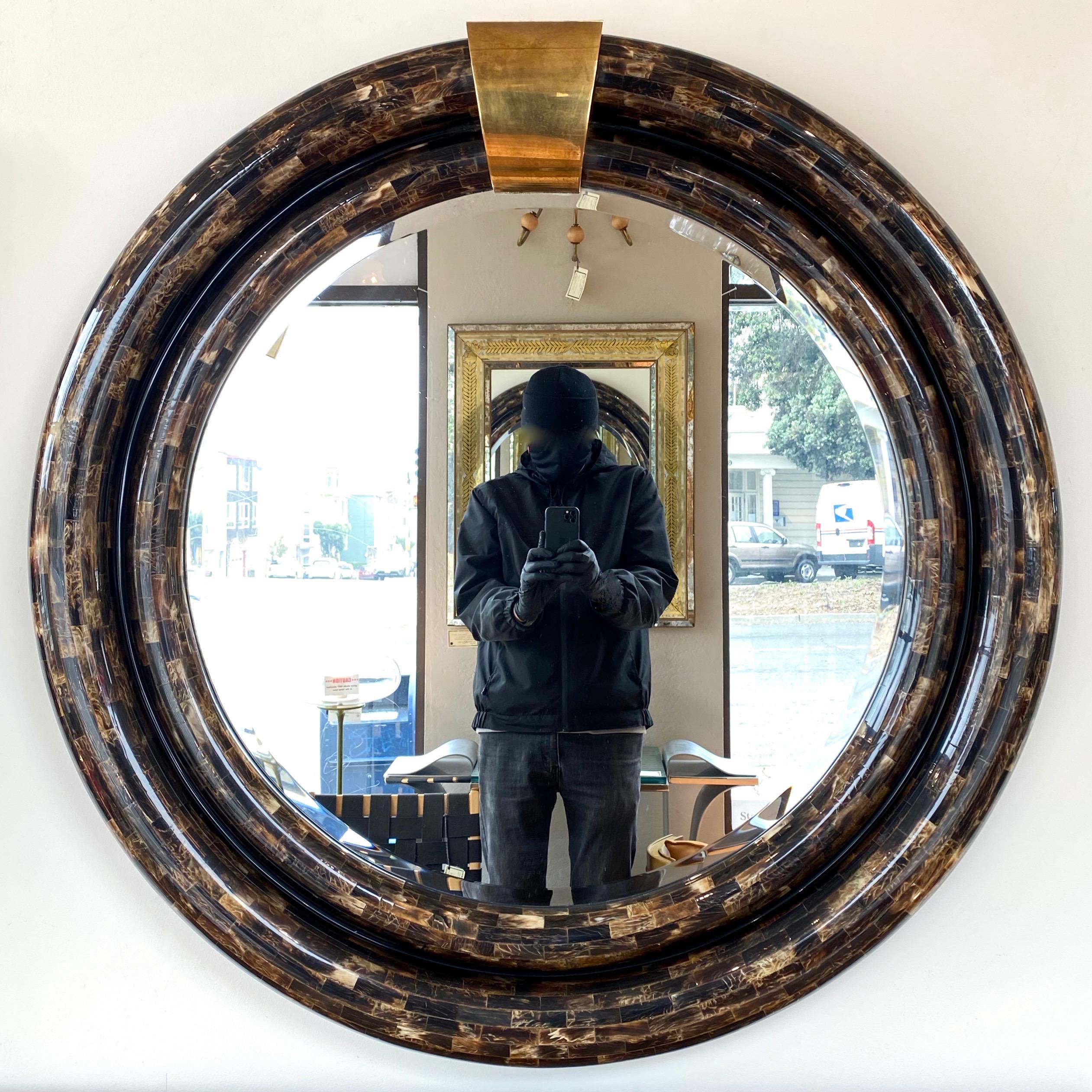 An absolutely stunning and likely bespoke 1970s tessellated horn and brass mirror by Ambience, done in the manner of Enrique Garcel or Karl Springer.

Large circular frame of two rounded, stepped rings covered in countless meticulously cut and
