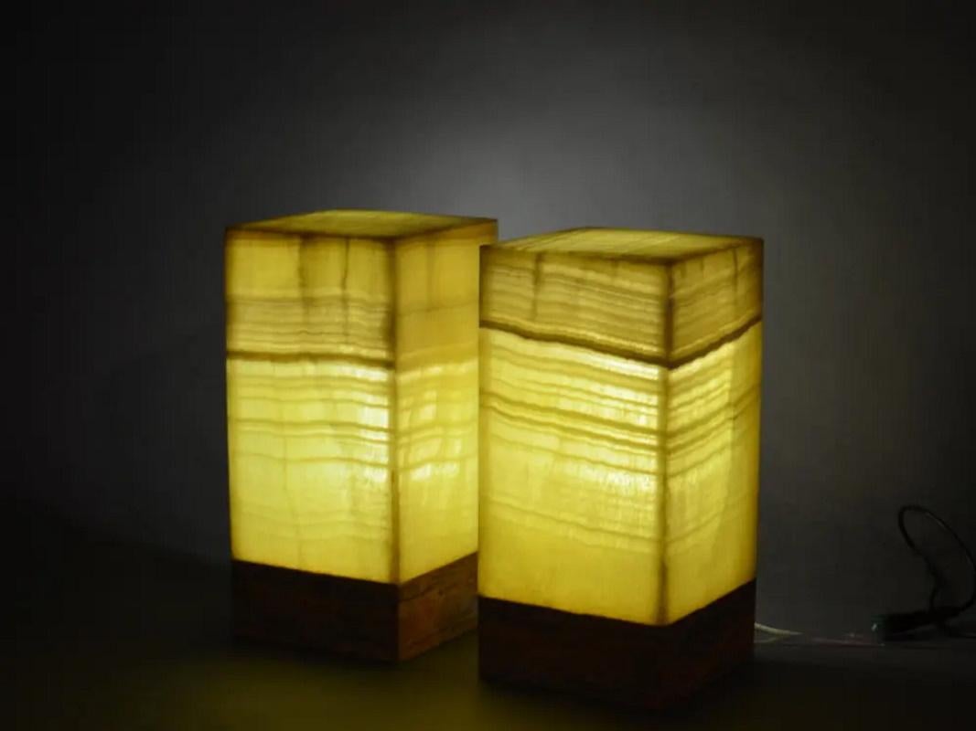 Square base ambient table lamp in onyx.