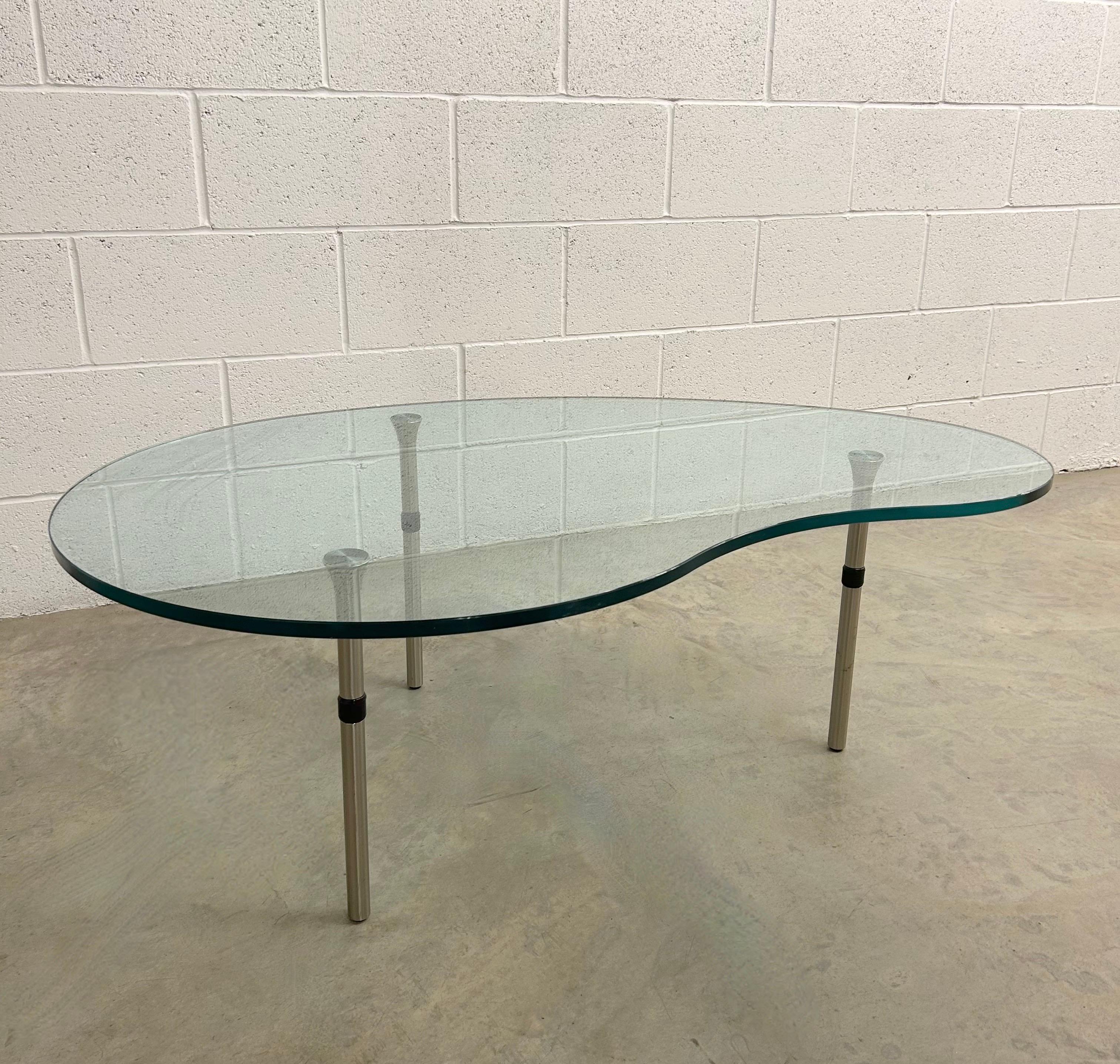 Ambo Coffee Table by Enzo Mari for Zanotta, Italy 1980’s

Vintage Ambo Coffee Table Set by Enzo Mari for Zanotta, Italy, 1980s.  Very good condition. The kidney-shaped glass table top sits cleanly over modern chrome-plated legs.  Circa 1980 - 1989. 