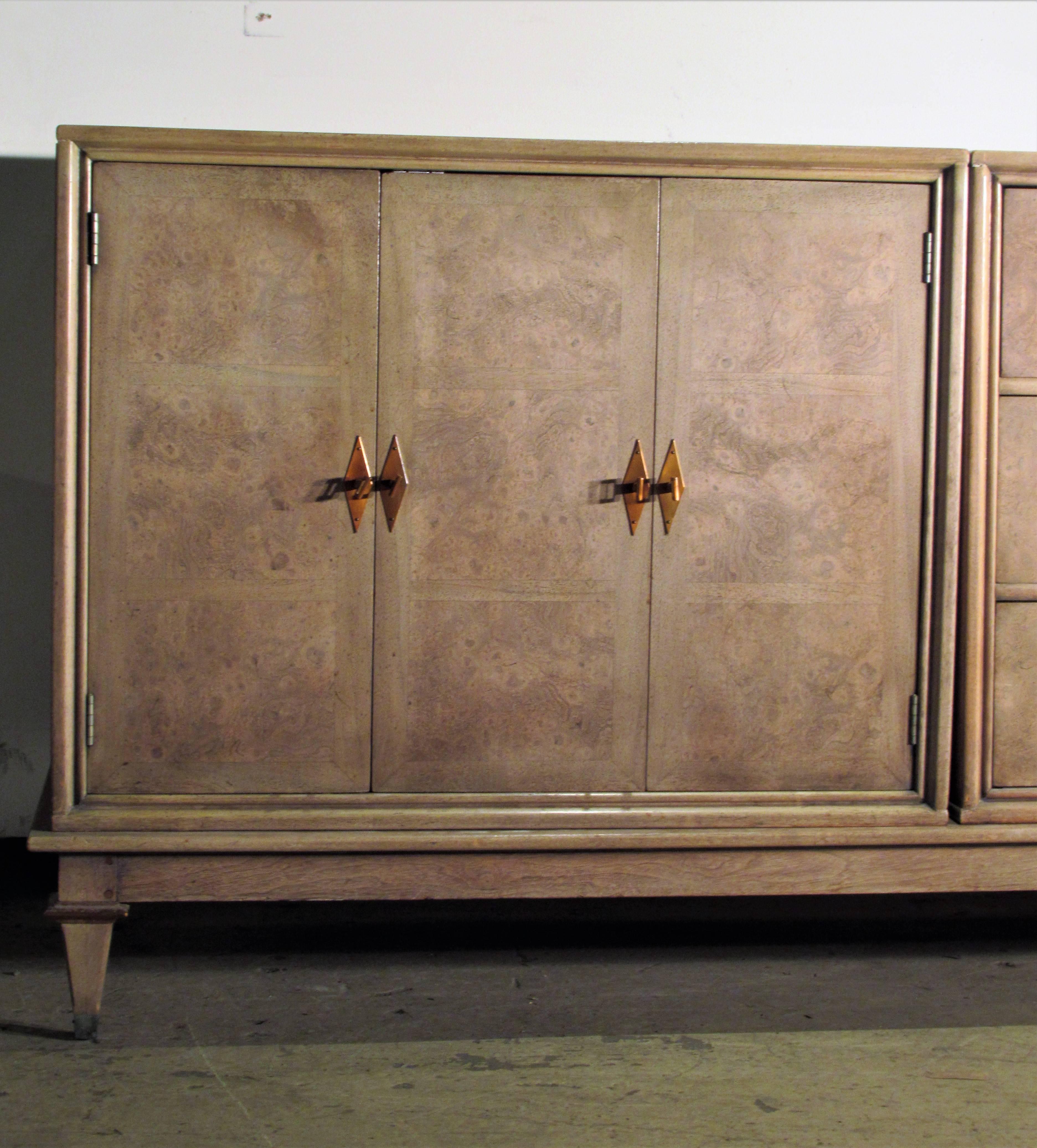 An amboyna burl and inlaid wood credenza with original pale cerused parchment vellum finish by Bernhard Rohne for Mastercraft - there are two folding door side cabinets each with four interior sliding drawers (see image 13) surrounding a centre
