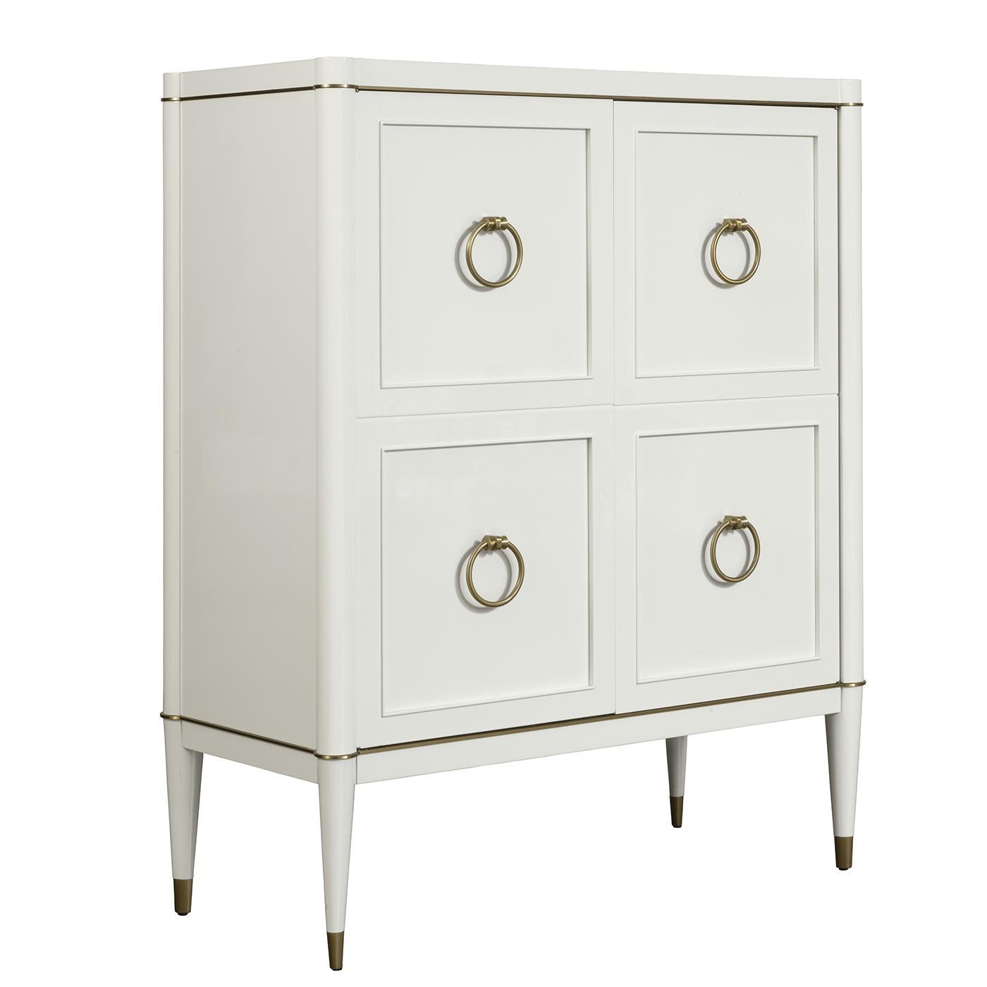 Part of the Ambra collection, this white cabinet is a stunning addition to both a classic and a modern decor. Combining traditional craftsmanship and materials with a linear design and bright colors, this piece is a timeless and versatile storage