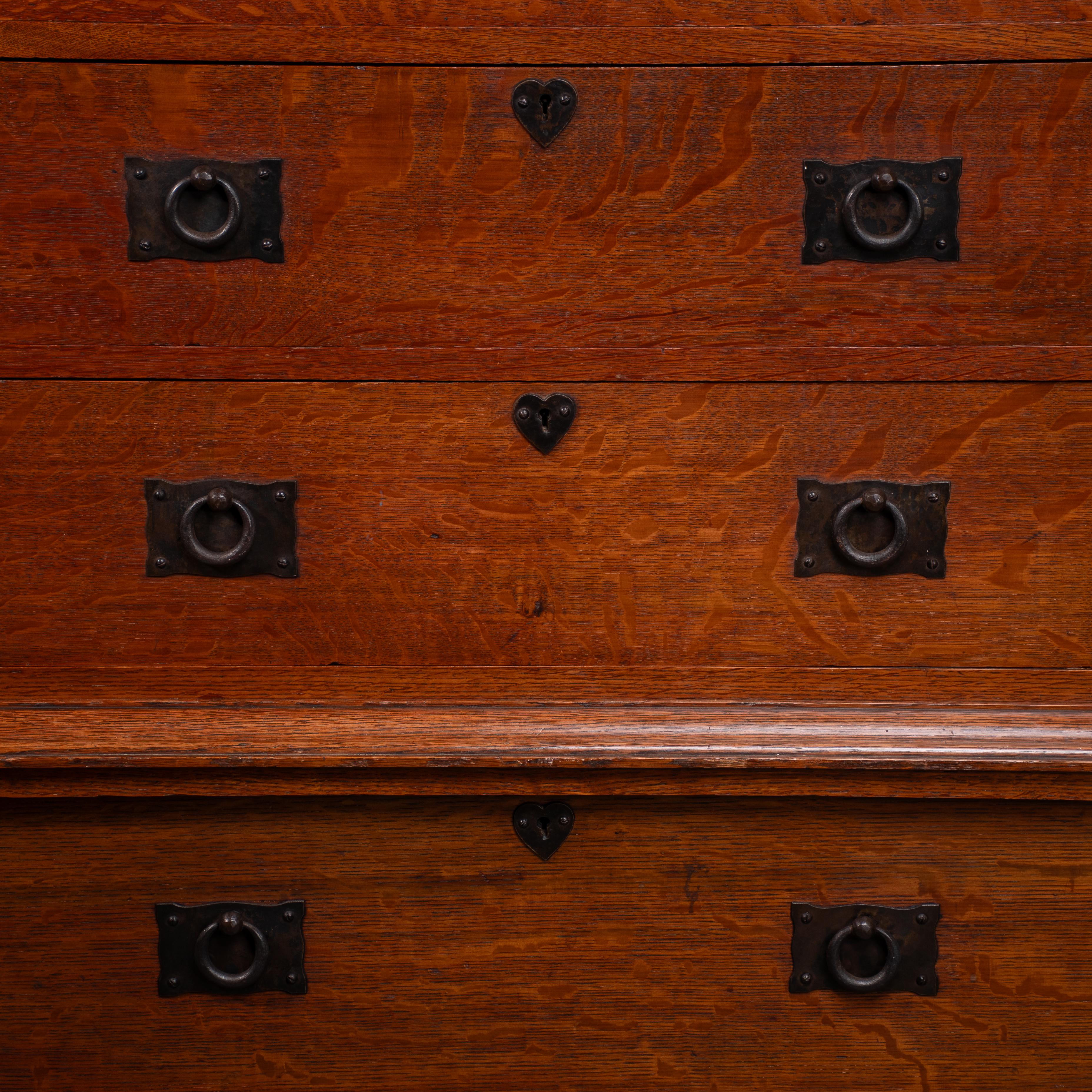 English Ambrose Heal A Rare Mansfield Oak Chest of Drawers With Iron Heart Escutcheons For Sale