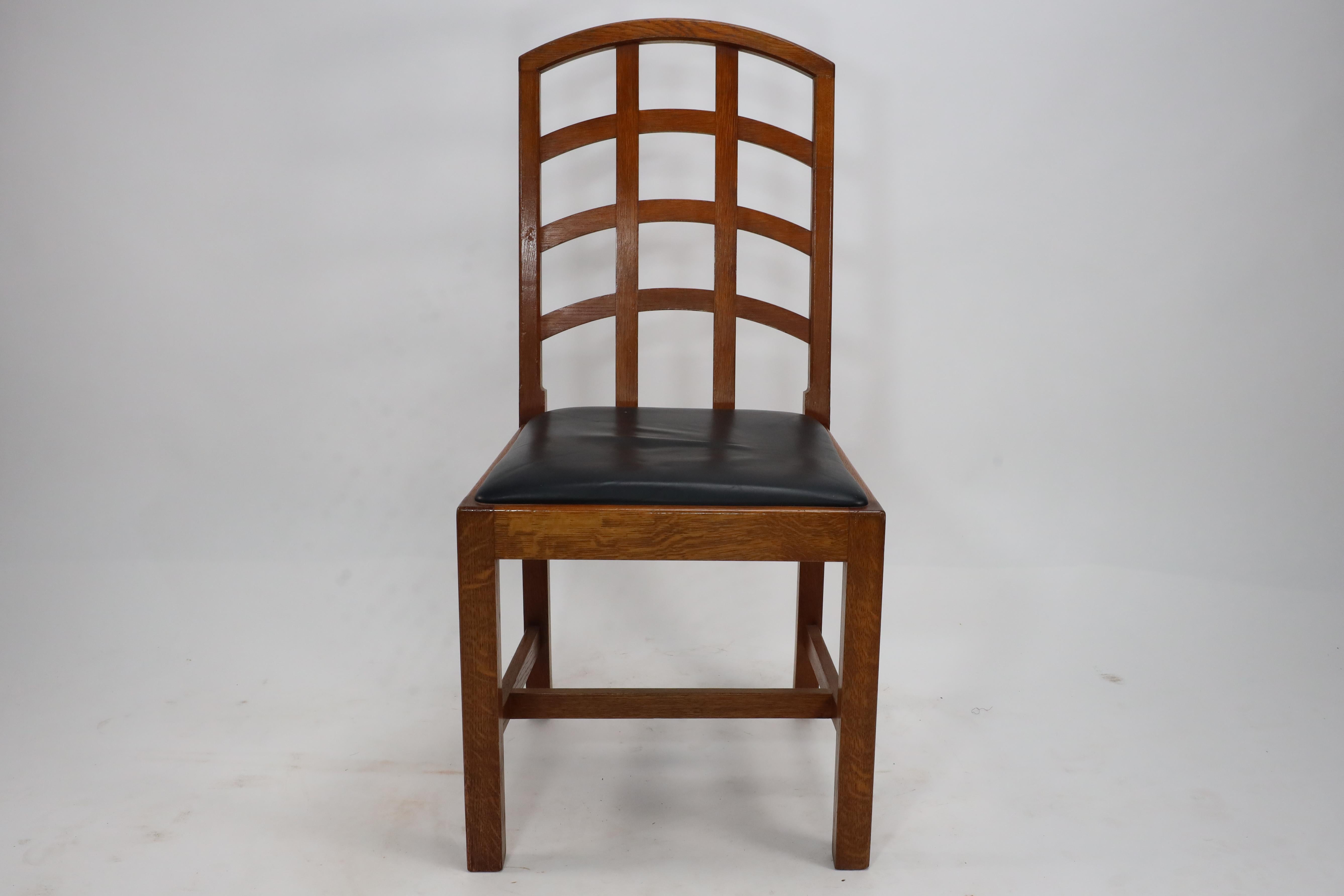  Ambrose Heal Arts and Crafts Oak Lattice Back Desk Chair made by Heals with original leather seat.