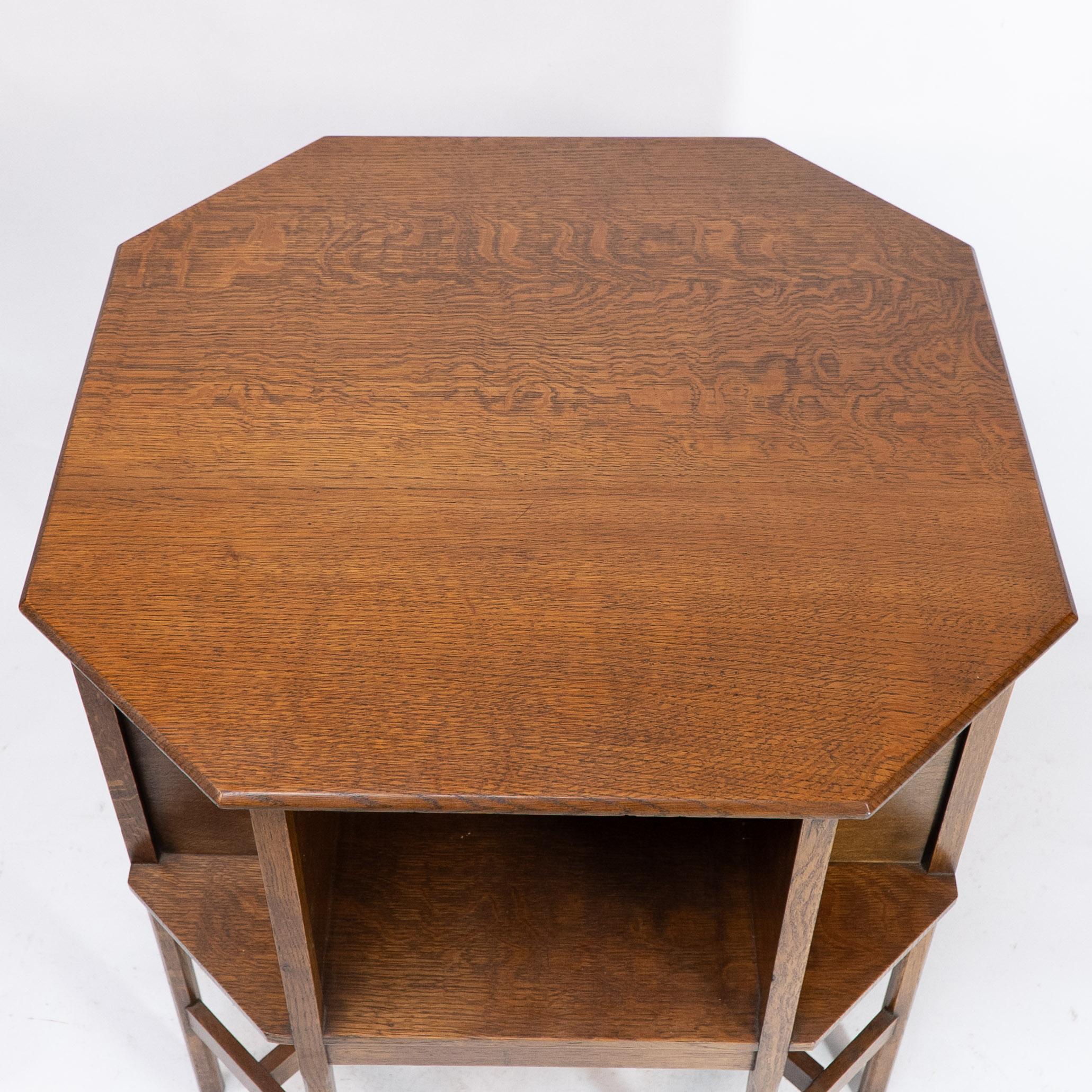 Ambrose Heals attri. An Arts & Crafts oak octagonal book table with eight legs 3