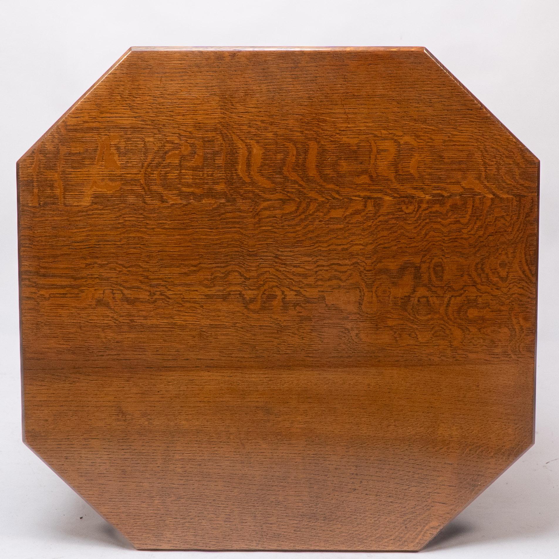 Ambrose Heals attri. An Arts & Crafts oak octagonal book table with eight legs 4