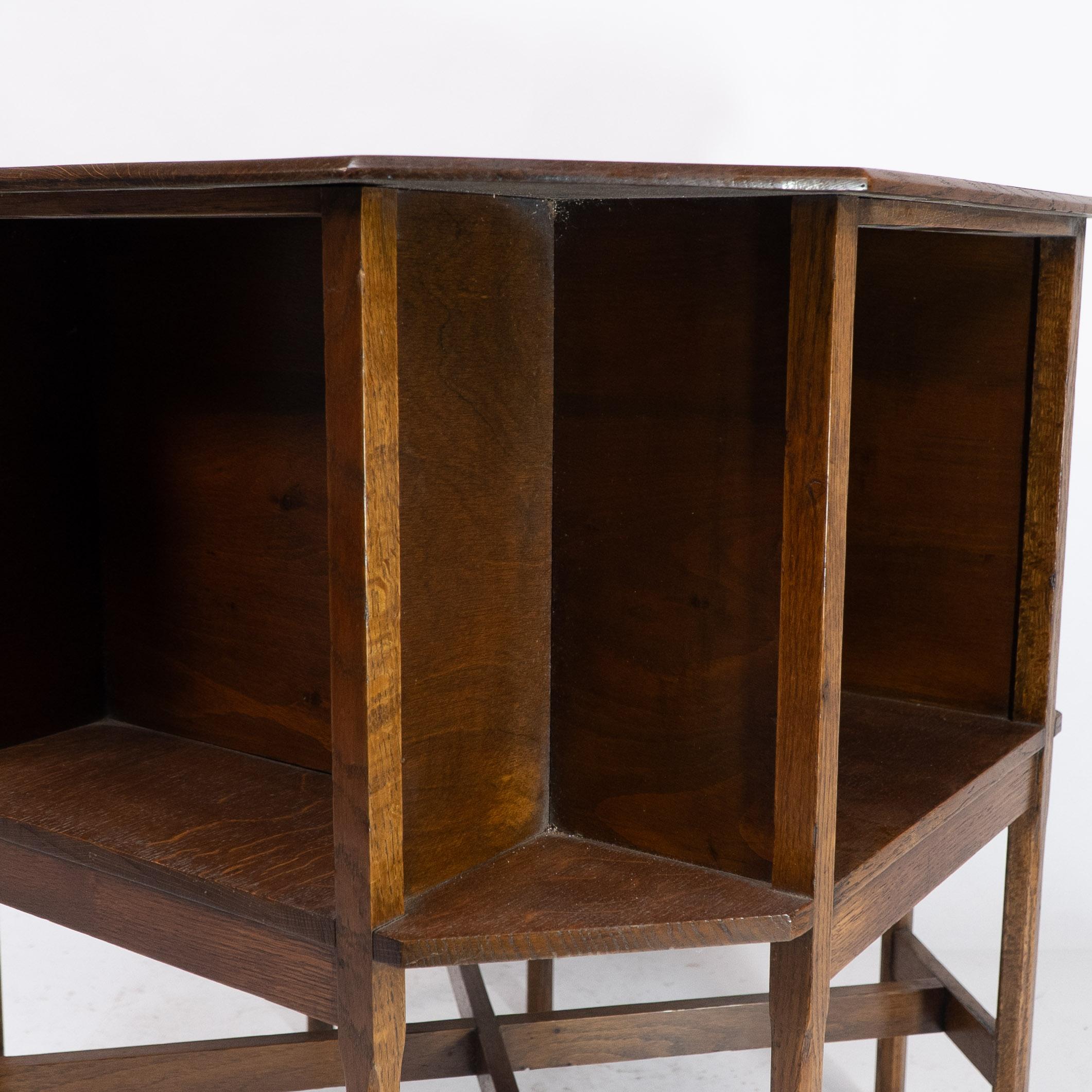 Ambrose Heals attri. An Arts & Crafts oak octagonal book table with eight legs 6