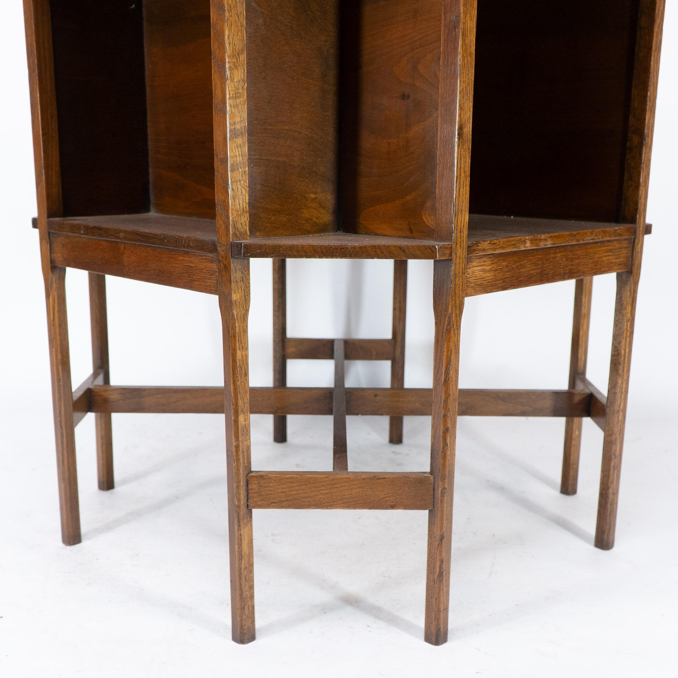 Ambrose Heals attri. An Arts & Crafts oak octagonal book table with eight legs 7