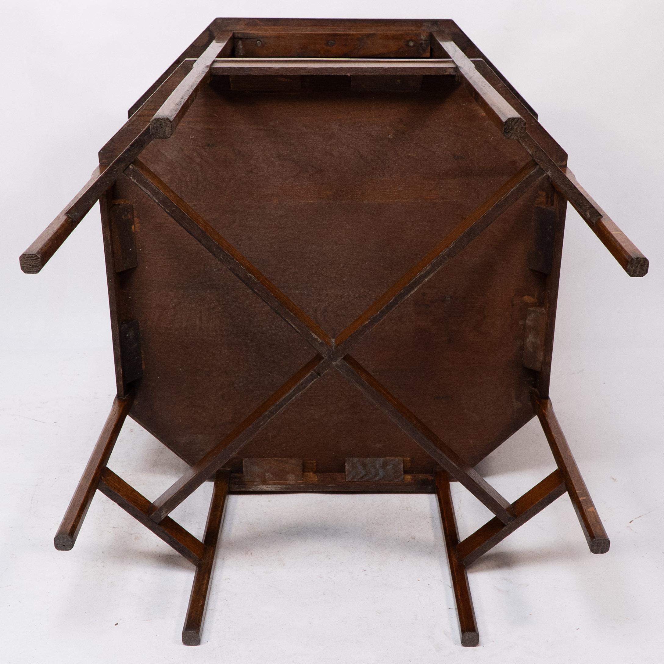 Ambrose Heals attri. An Arts & Crafts oak octagonal book table with eight legs 10