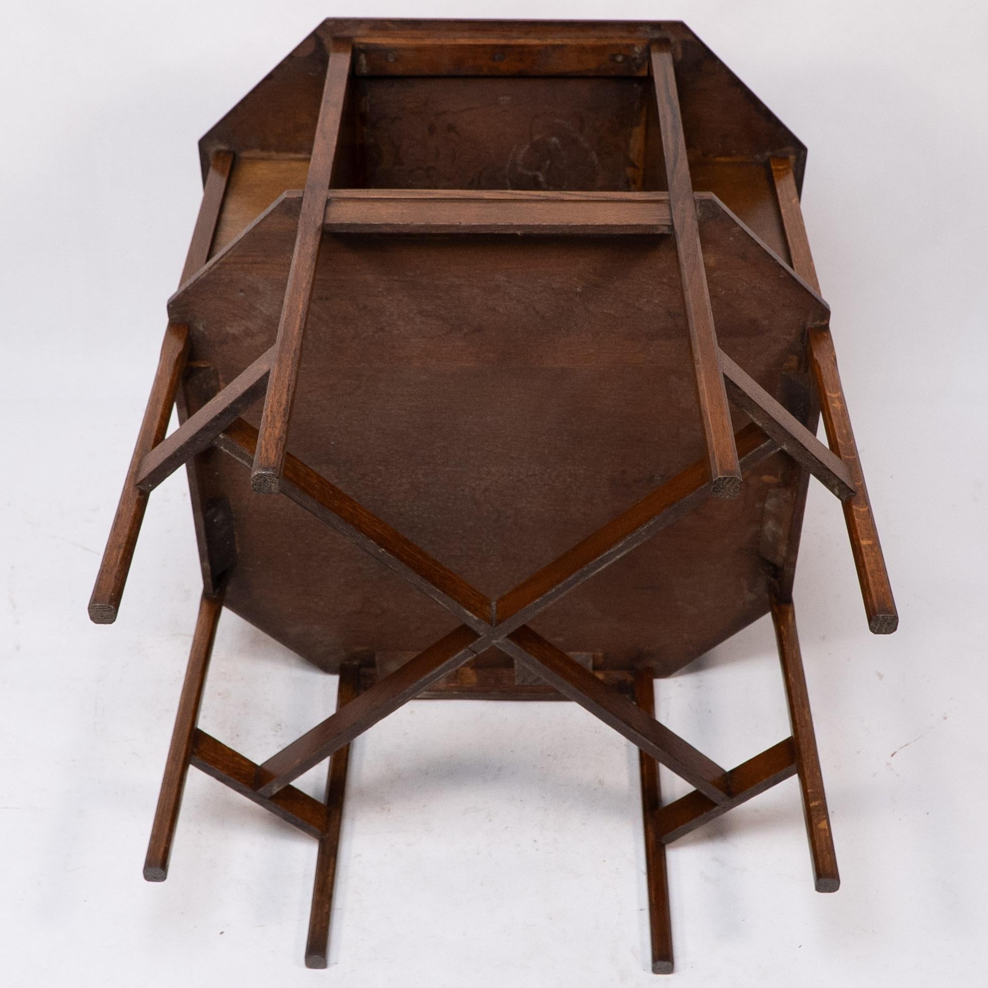 Ambrose Heals attri. An Arts & Crafts oak octagonal book table with eight legs 11