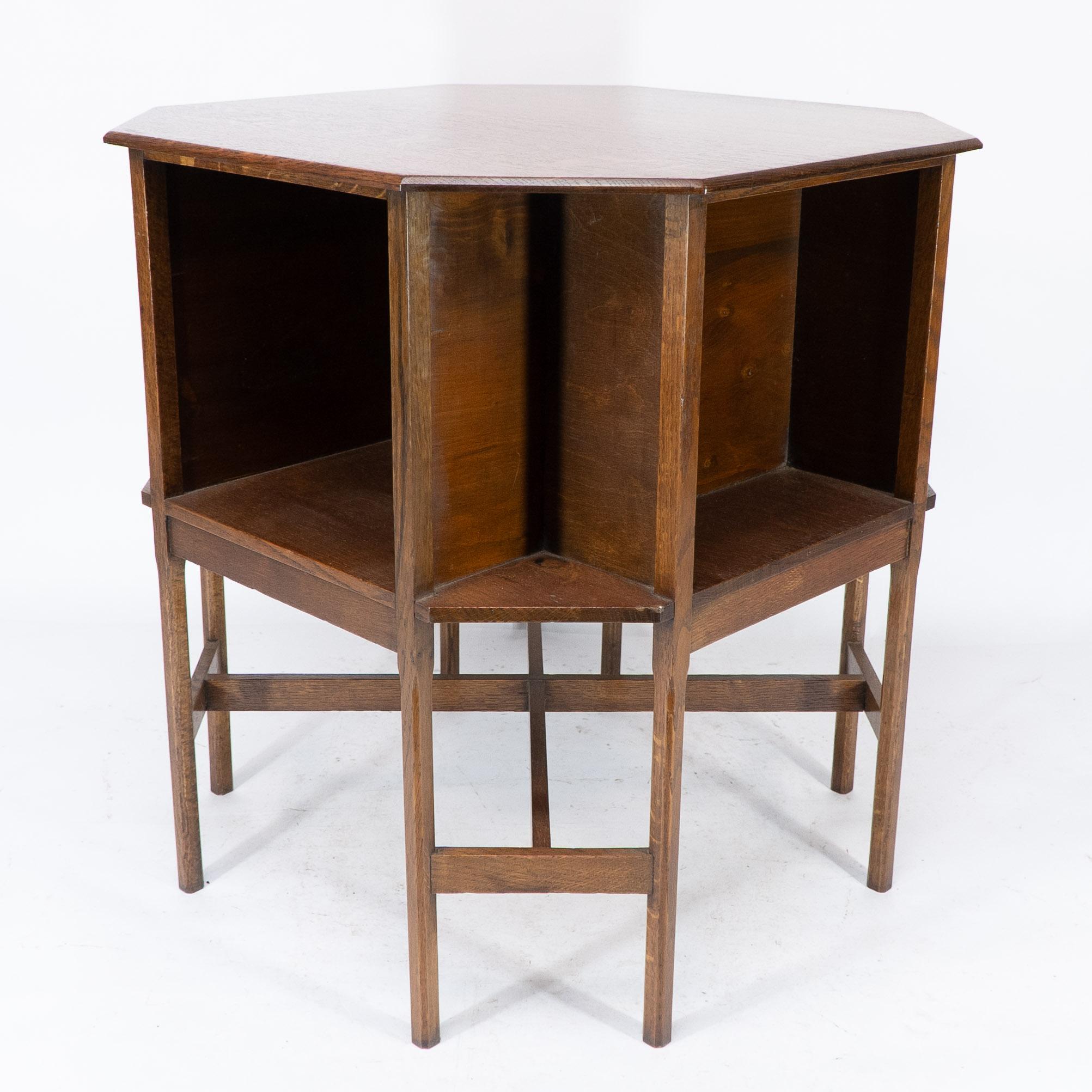 Arts and Crafts Ambrose Heals attri. An Arts & Crafts oak octagonal book table with eight legs