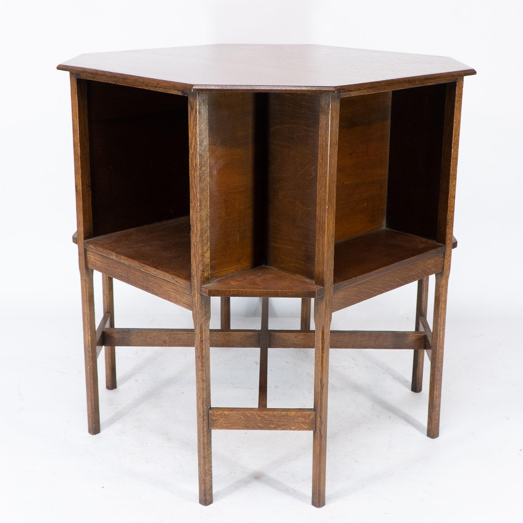 Oak Ambrose Heals attri. An Arts & Crafts oak octagonal book table with eight legs