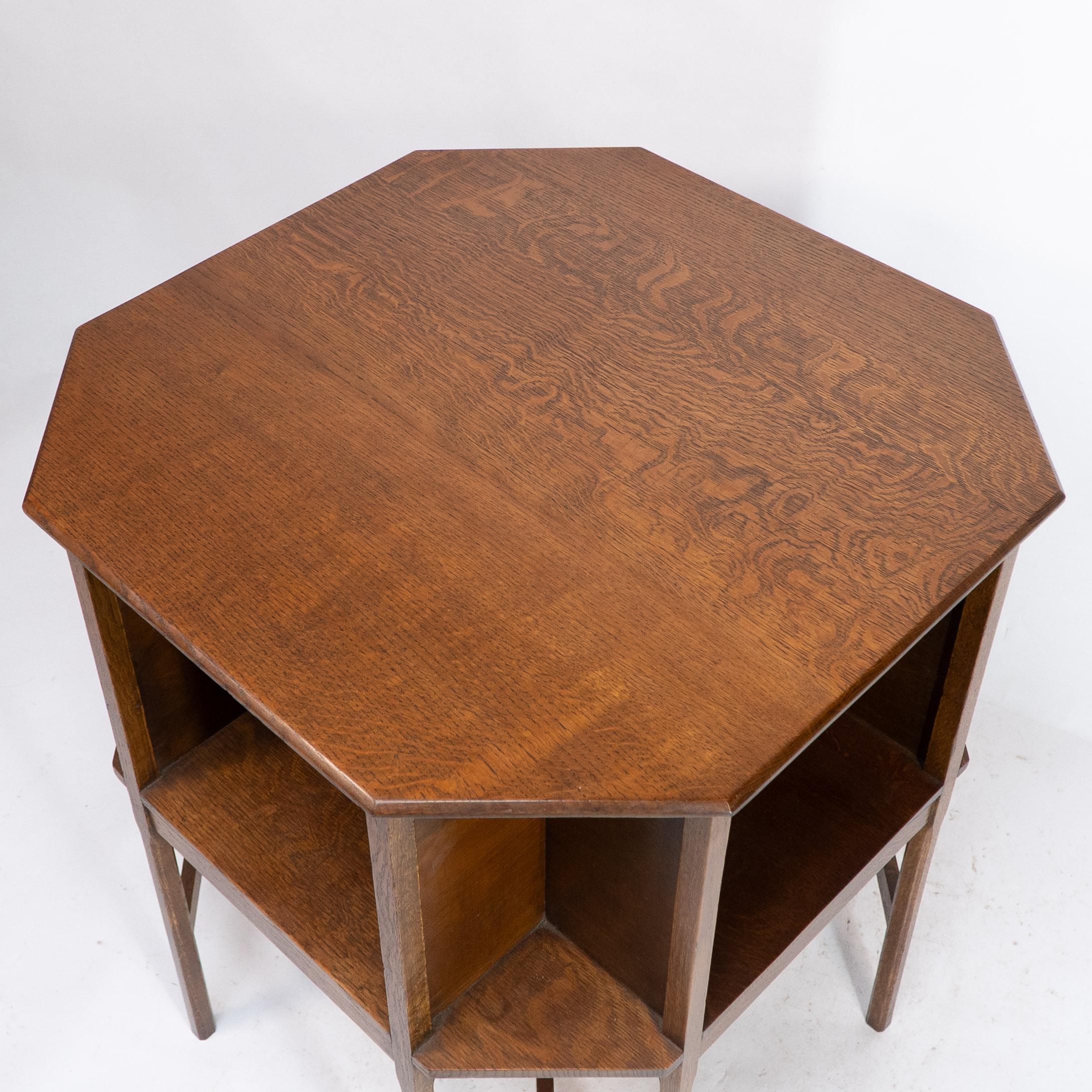 Ambrose Heals attri. An Arts & Crafts oak octagonal book table with eight legs 2