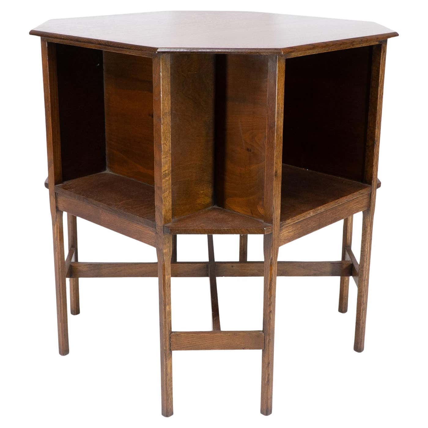 Ambrose Heals attri. An Arts and Crafts oak octagonal book table with ...