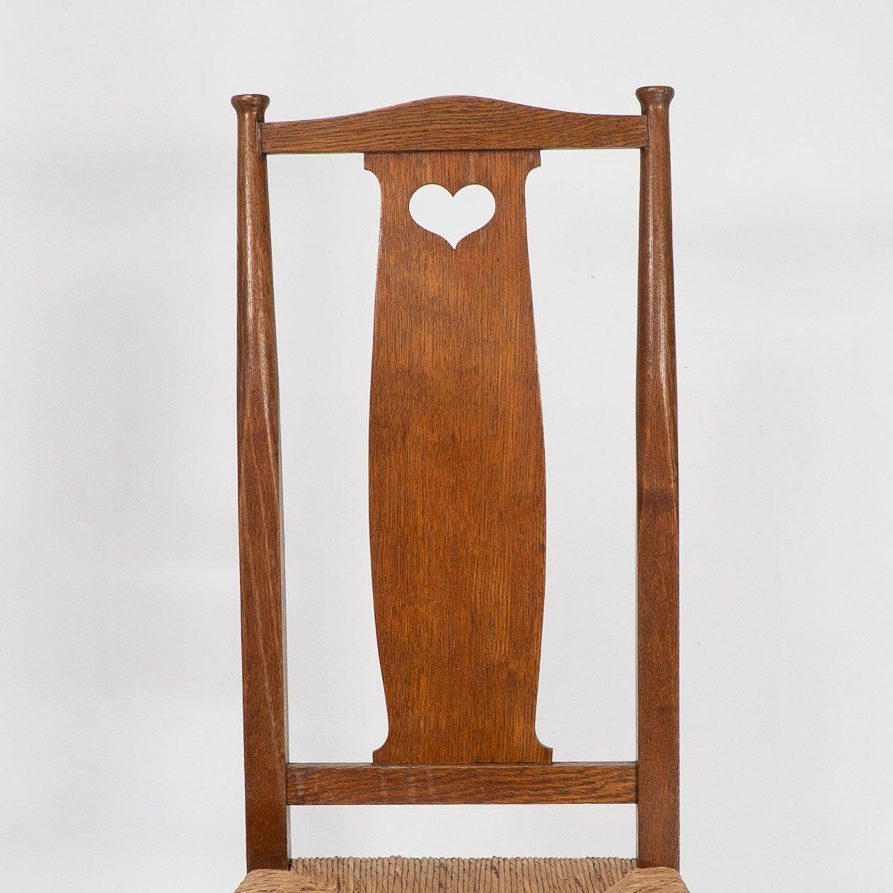 Ambrose Heals for Heals of London. A pair of Arts and Crafts rush seated chairs For Sale 6