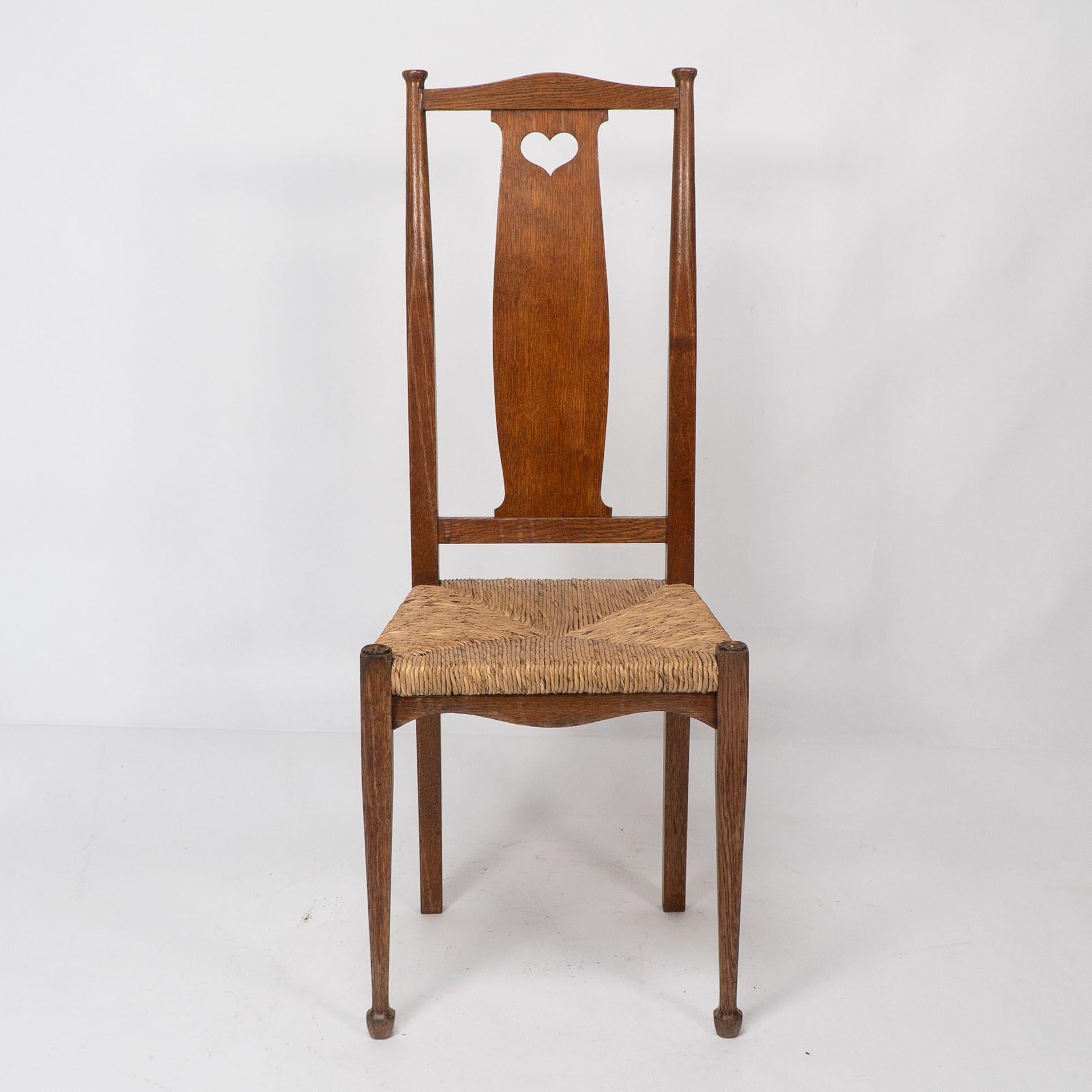 Ambrose Heals for Heals of London. A pair of Arts and Crafts rush seated chairs For Sale 1