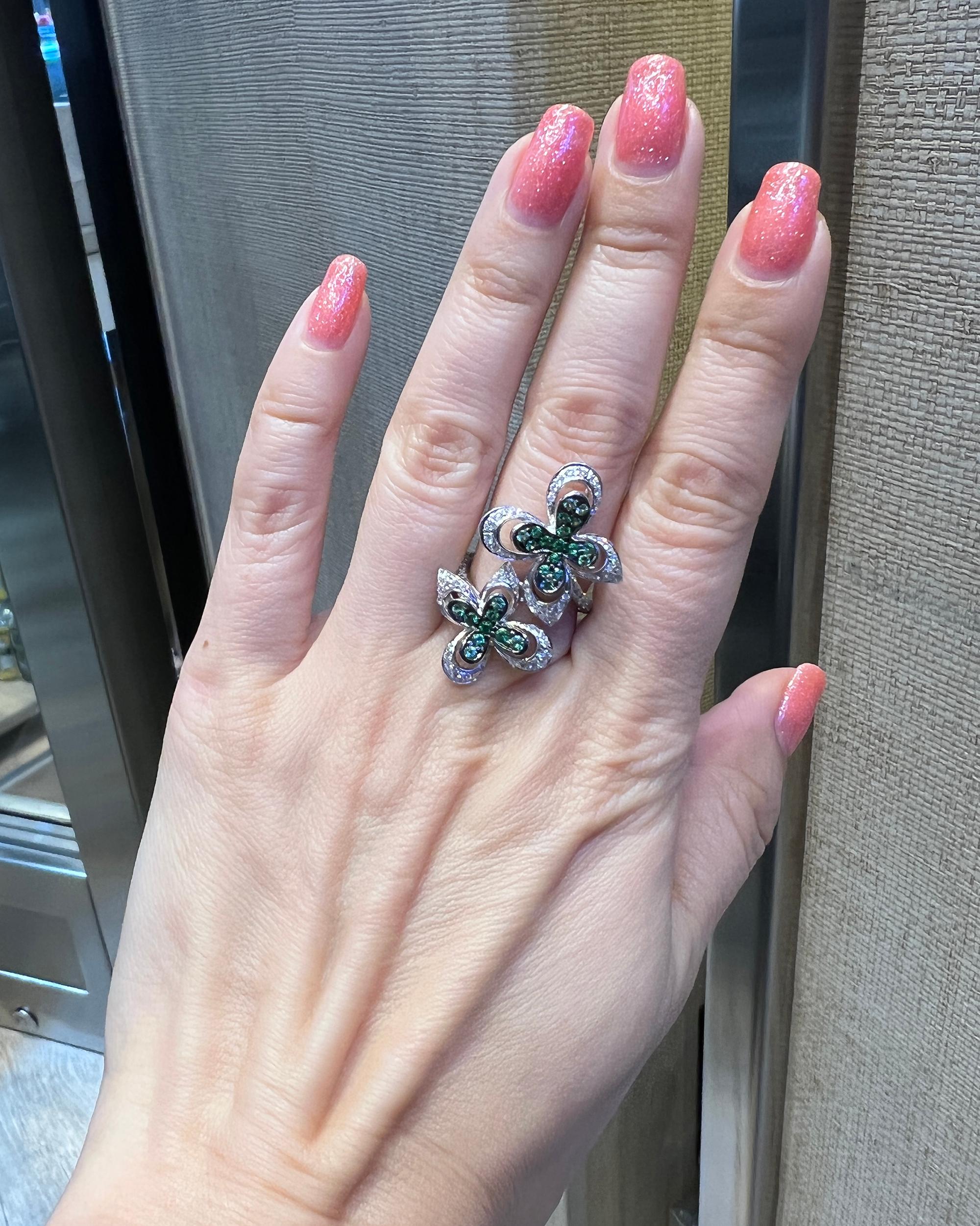 A beautiful cocktail ring comprising of the diamonds and tsavorite gemstones. 
Created by Ambrosi. 
Total weight of diamonds is 1.00 carat.
Total weight of tsavorites is 0.59 carats. 
Metal is 18k gold weighing 10.60 grams.
Size 6.
Measurements:
