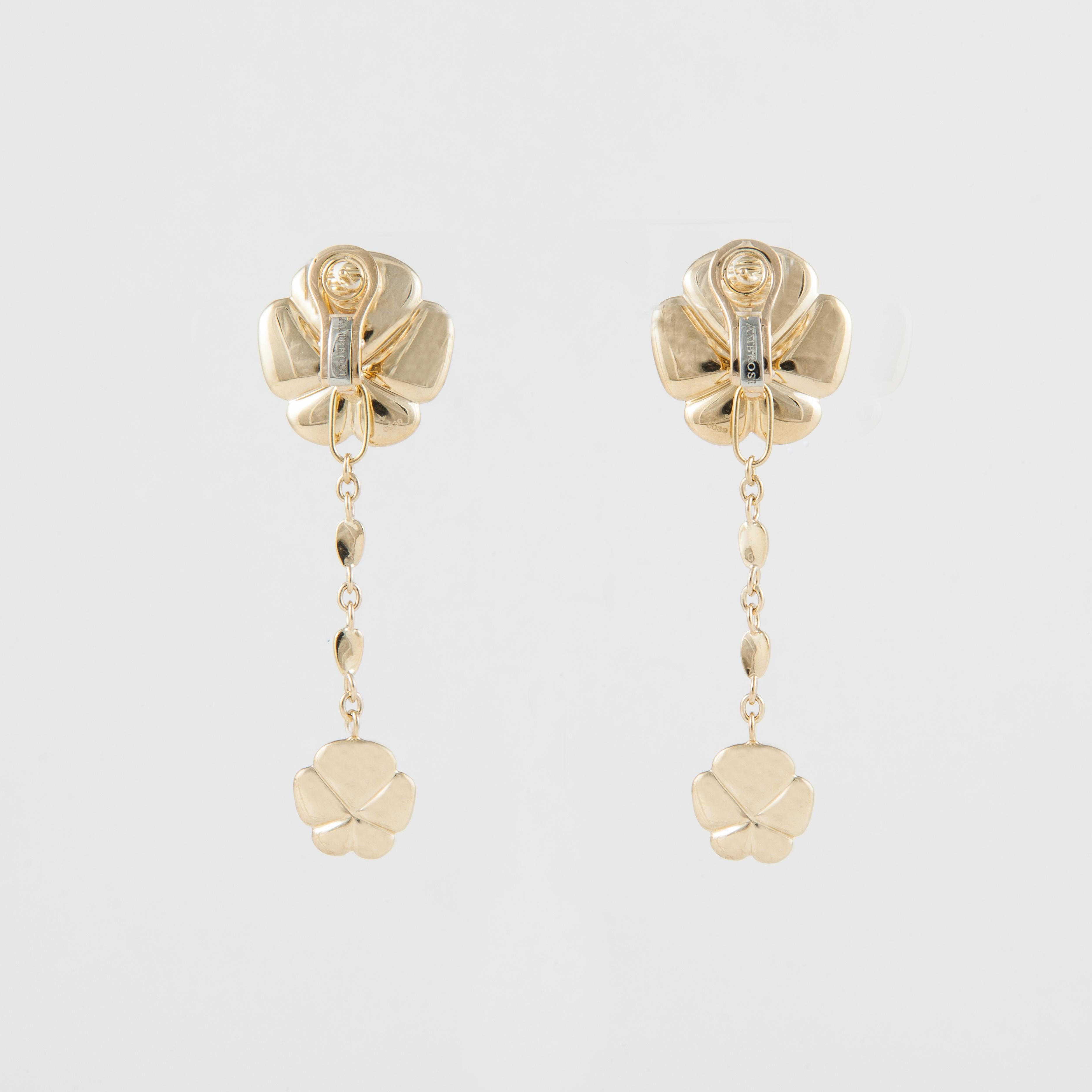 Ambrosi 18K yellow gold dangle earrings featuring a large clover like leaf at the top and dangling from a chain is a smaller version.  Measure 2 1/2 inches long and 7/8 inches wide.  They are for pierced ears with a lever back.