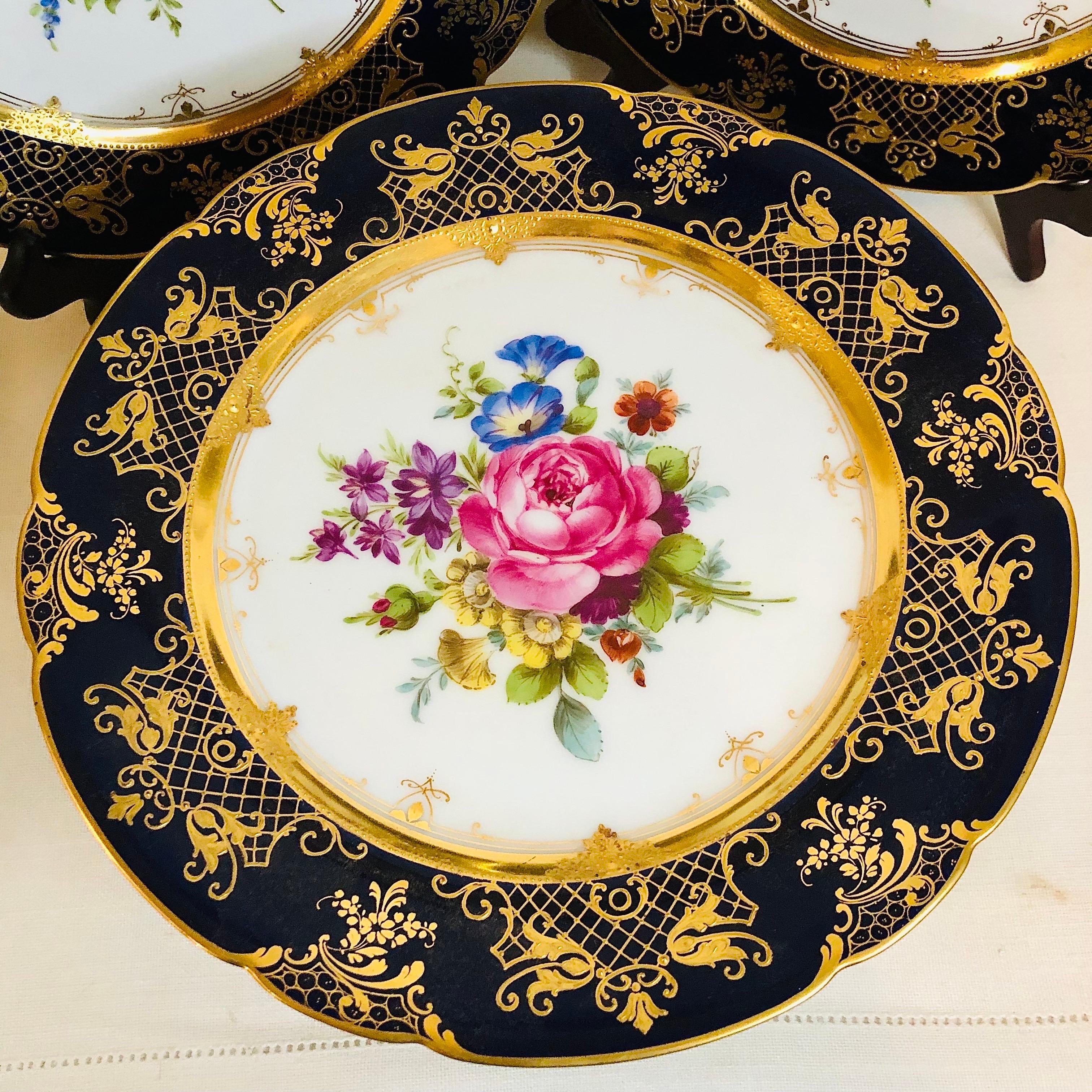 These are a set of nine exquisite Ambrosius Lamm Dresden wide rim soup bowls. These exemplify the fabulous talent of the artists of the Ambrosius Lamm Dresden decorators over a hundred years ago. Each bowl has a different large majestic bouquet of