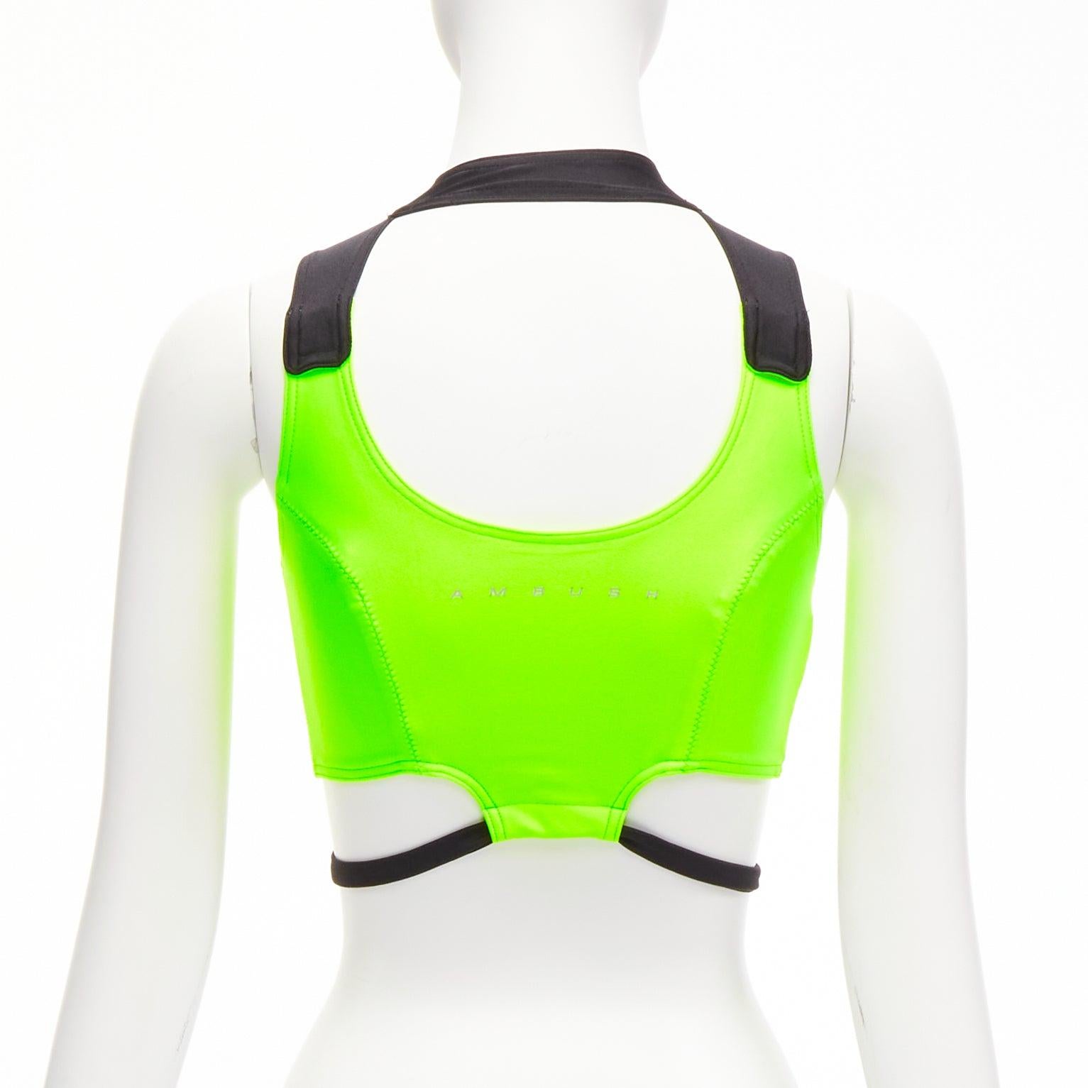 AMBUSH neon green black panelled logo back waist tie cropped sports top Size 1 S

Reference: BSHW/A00032
Brand: Ambush
Color: Green, Black
Pattern: Solid
Closure: Snap Buttons
Extra Details: Snap button back neck closure.

CONDITION:
Condition: Very