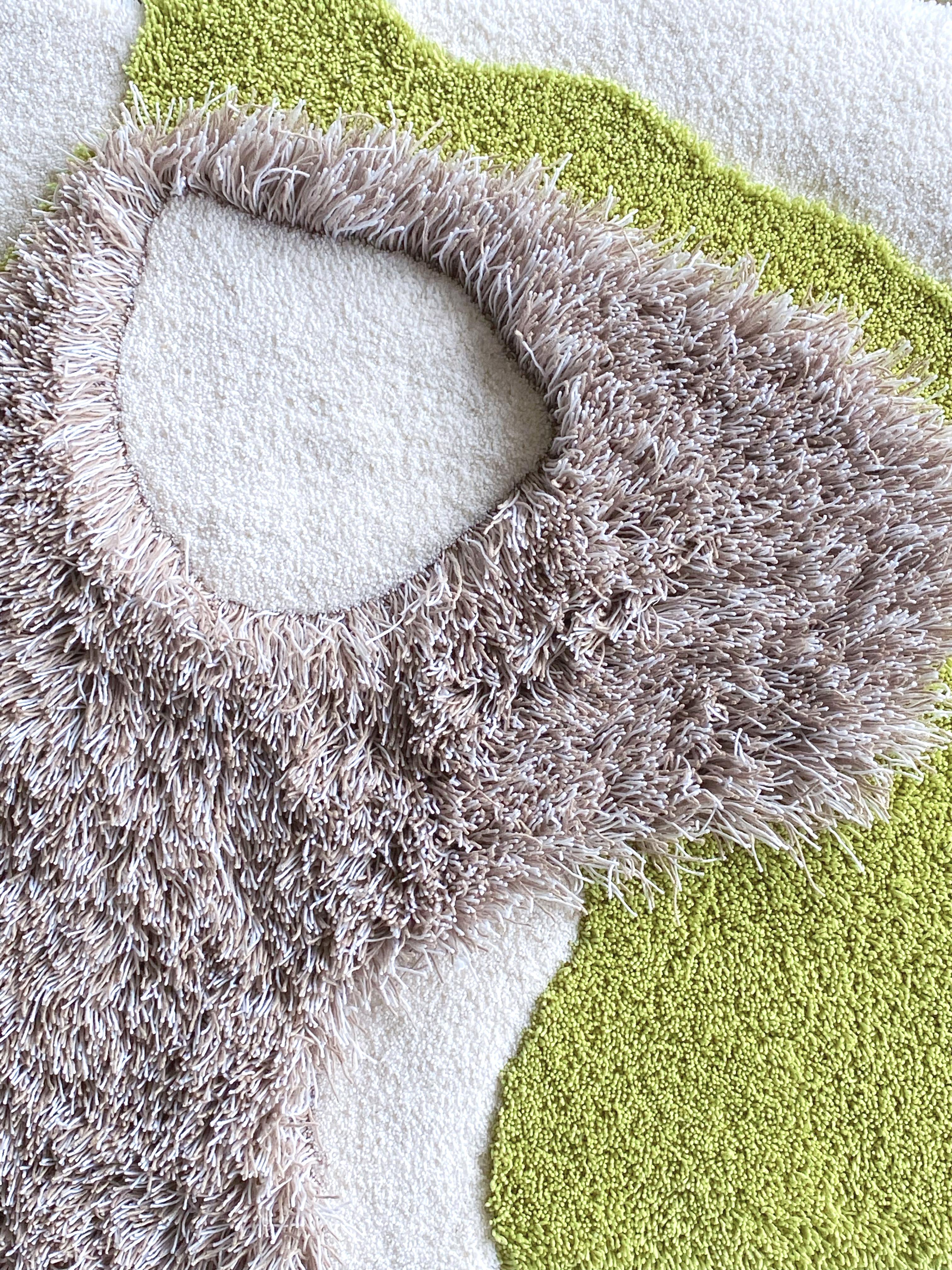 Ro can be used as a wall piece or a rug on the floor.
The piece is hand tufted using abstract forms and cut-out details, made with the idea of dividing the rug into softer areas for sitting. 

The design is a play with texture and softness by using