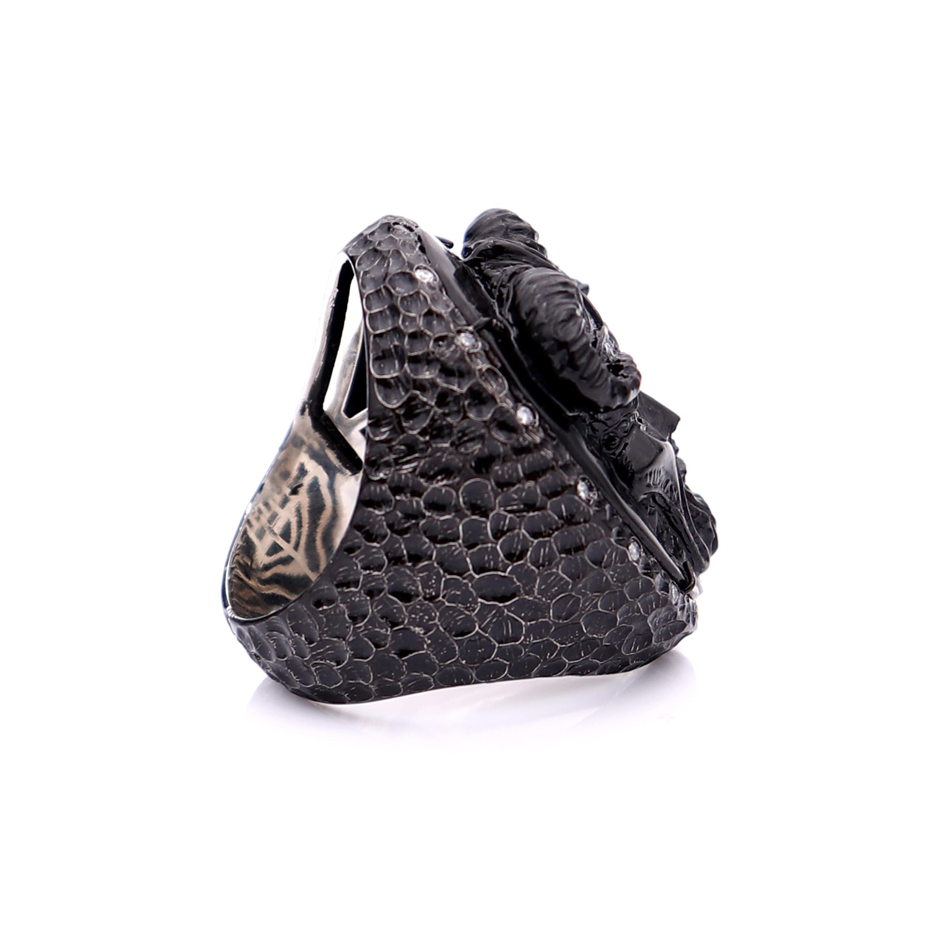 30mm black Belgian marble, hand-carved set on sterling silver black rhodium plated with 0.16cts of white diamonds.