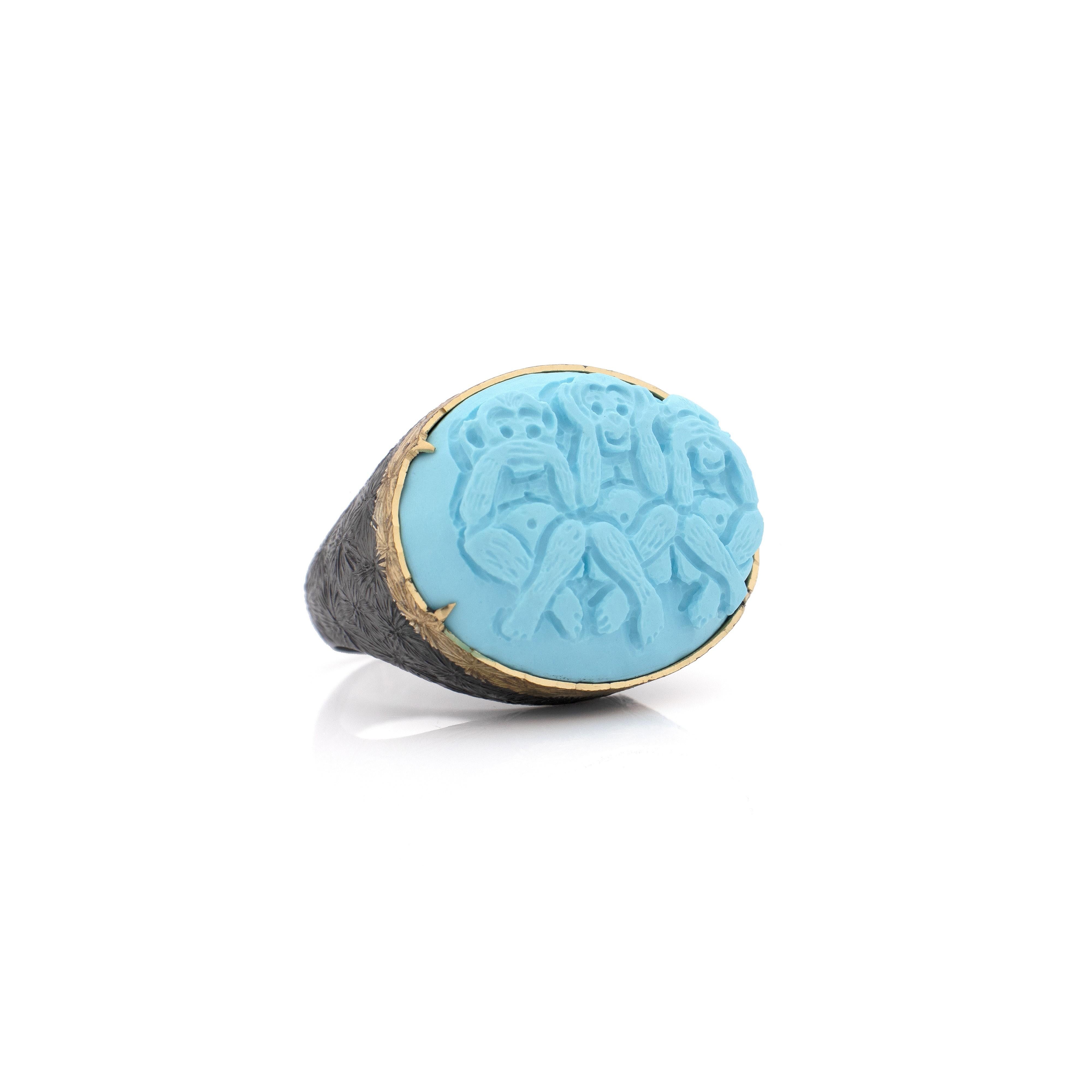 25mm turquoise cameo hand-carved on 18kt gold and sterling silver black rhodium.