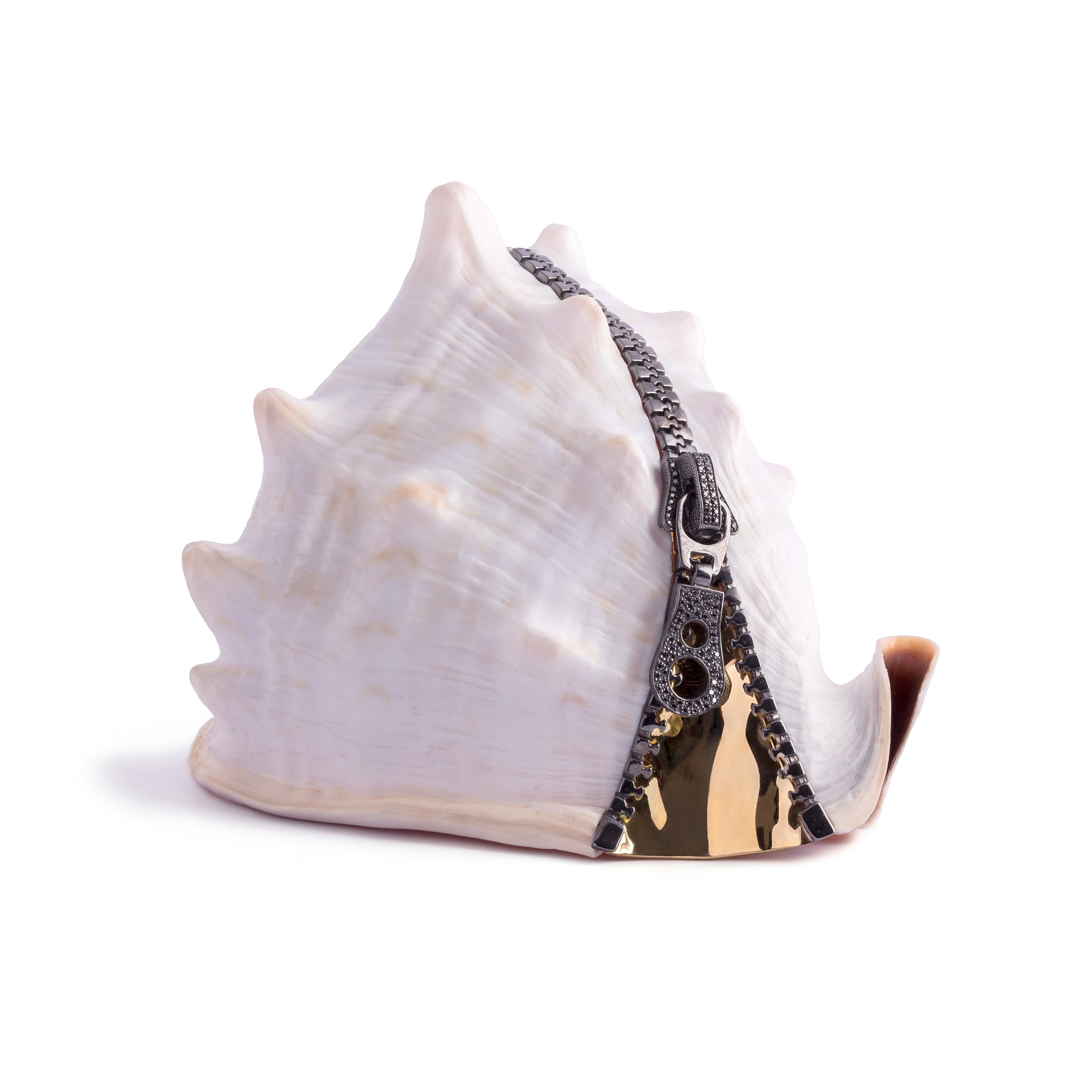 This is a one-of-a-kind hand-carved cassis madagascariensis (sardonyx) conch shell with 14Kt Italian yellow gold, sterling silver and black diamonds.