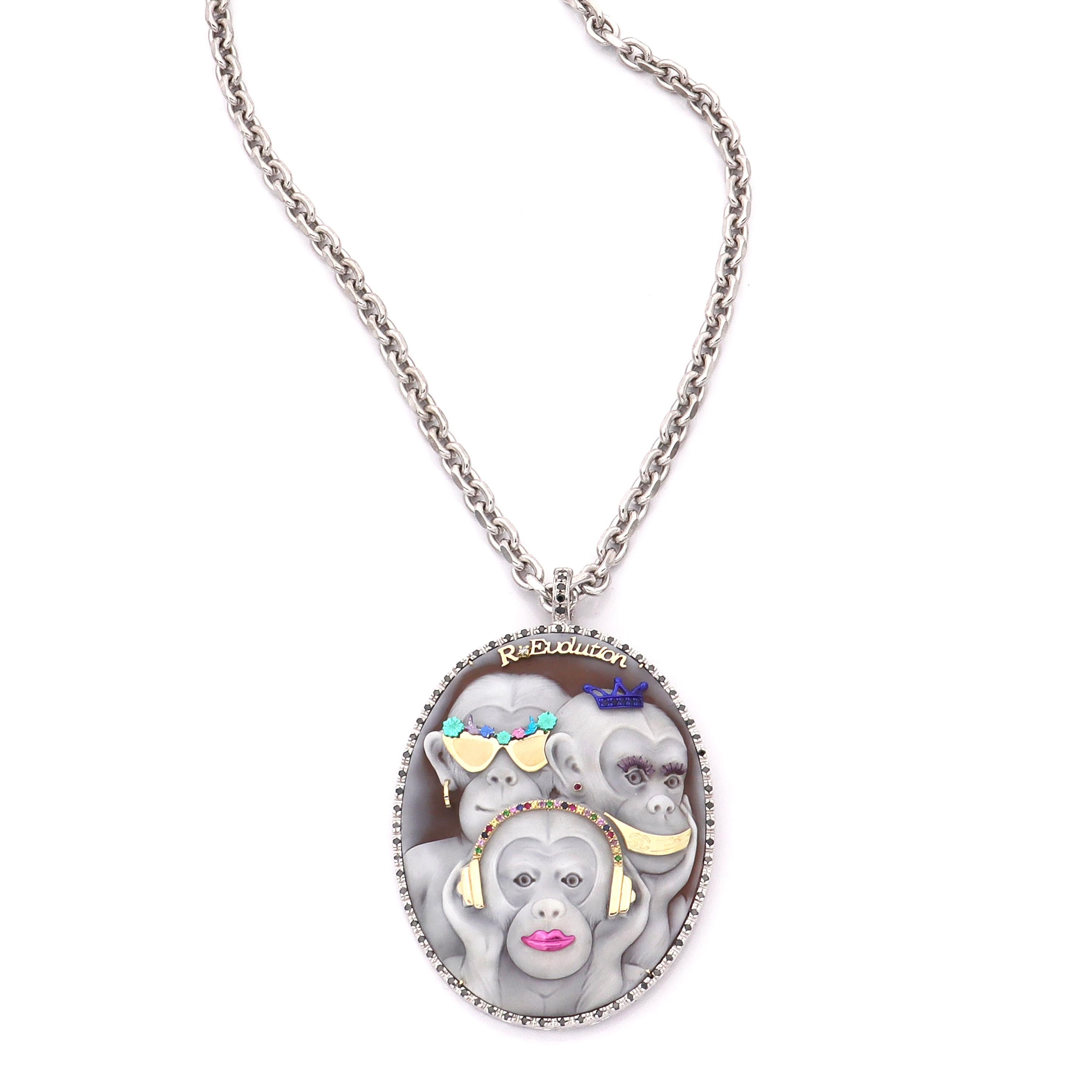 78mm sardonyx shell cameo, hand-carved set on 18kt gold and sterling silver with 1.05cts of black diamonds, 0.030cts of white diamonds, 0.38ct multistones (yellow sapphires, blue sapphires, pink sapphires, ruby, amethyst and tsavorites)

Chain: