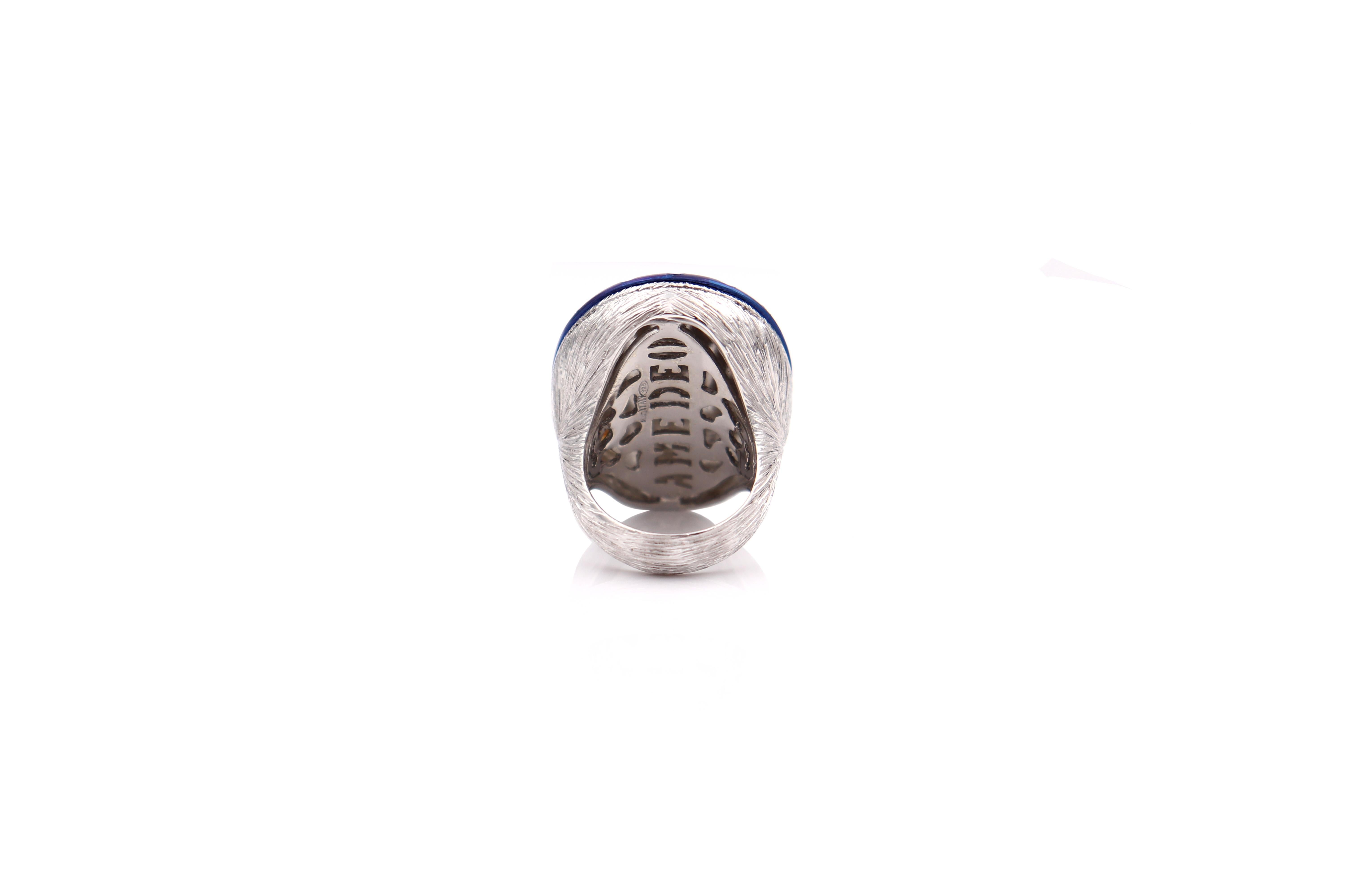 30mm agate hand-carved, set on sterling silver, white rhodium and titanium with 0.25cts of blue sapphires.