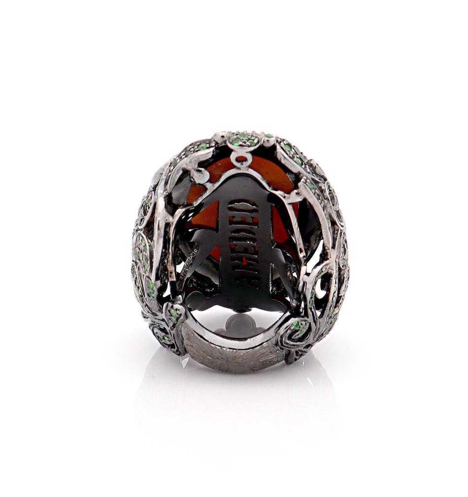 40mm sardonyx shell cameo hand-carved set on sterling silver, black rhodium with 0.68cts of black diamonds and 3.07cts of tsavorites.
