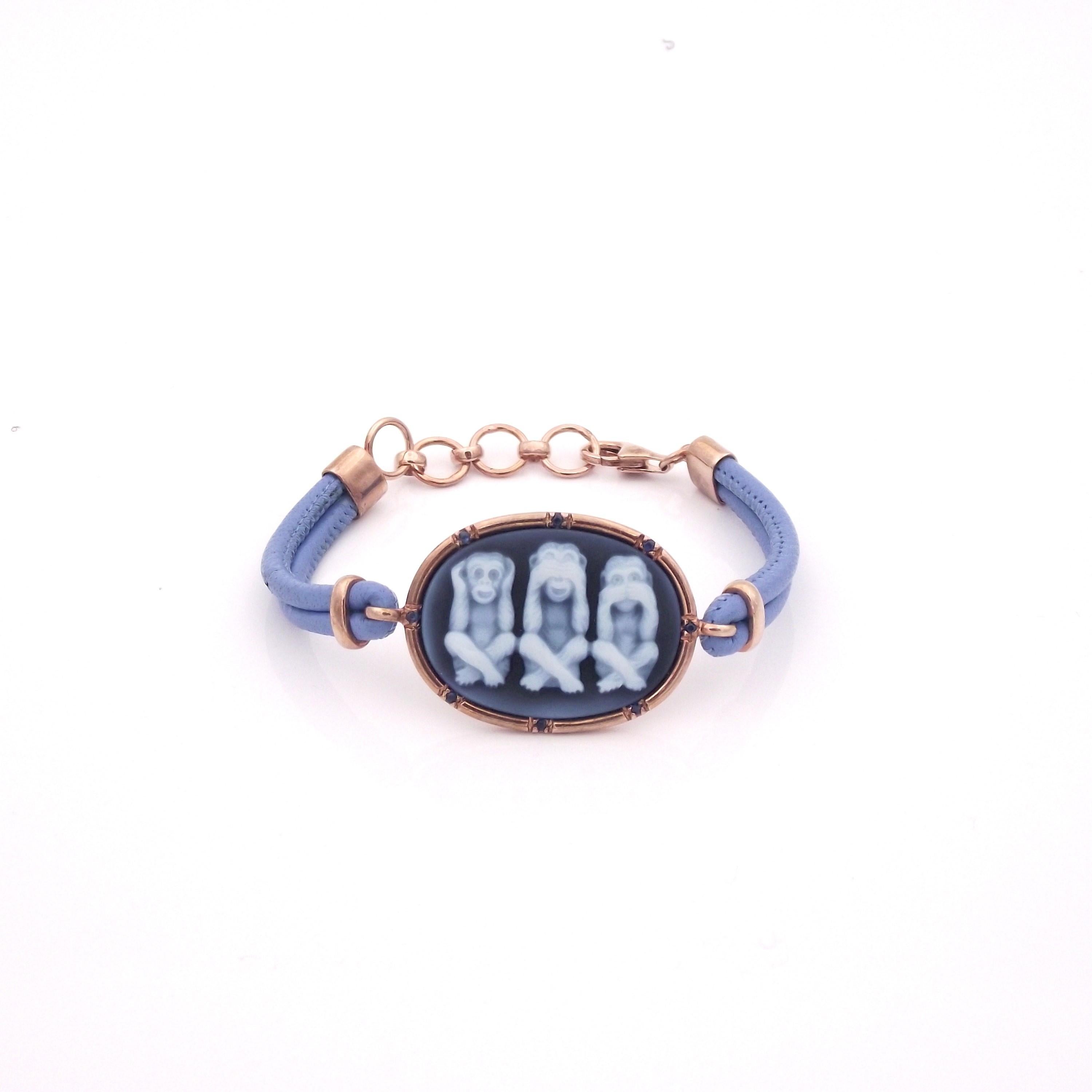 30mm blue agate cameo hand-carved, sterling silver rose rhodium plated with 0.15ct blue sapphires and leather.
This items comes in other colors such as turquoise, pink, violent and green.