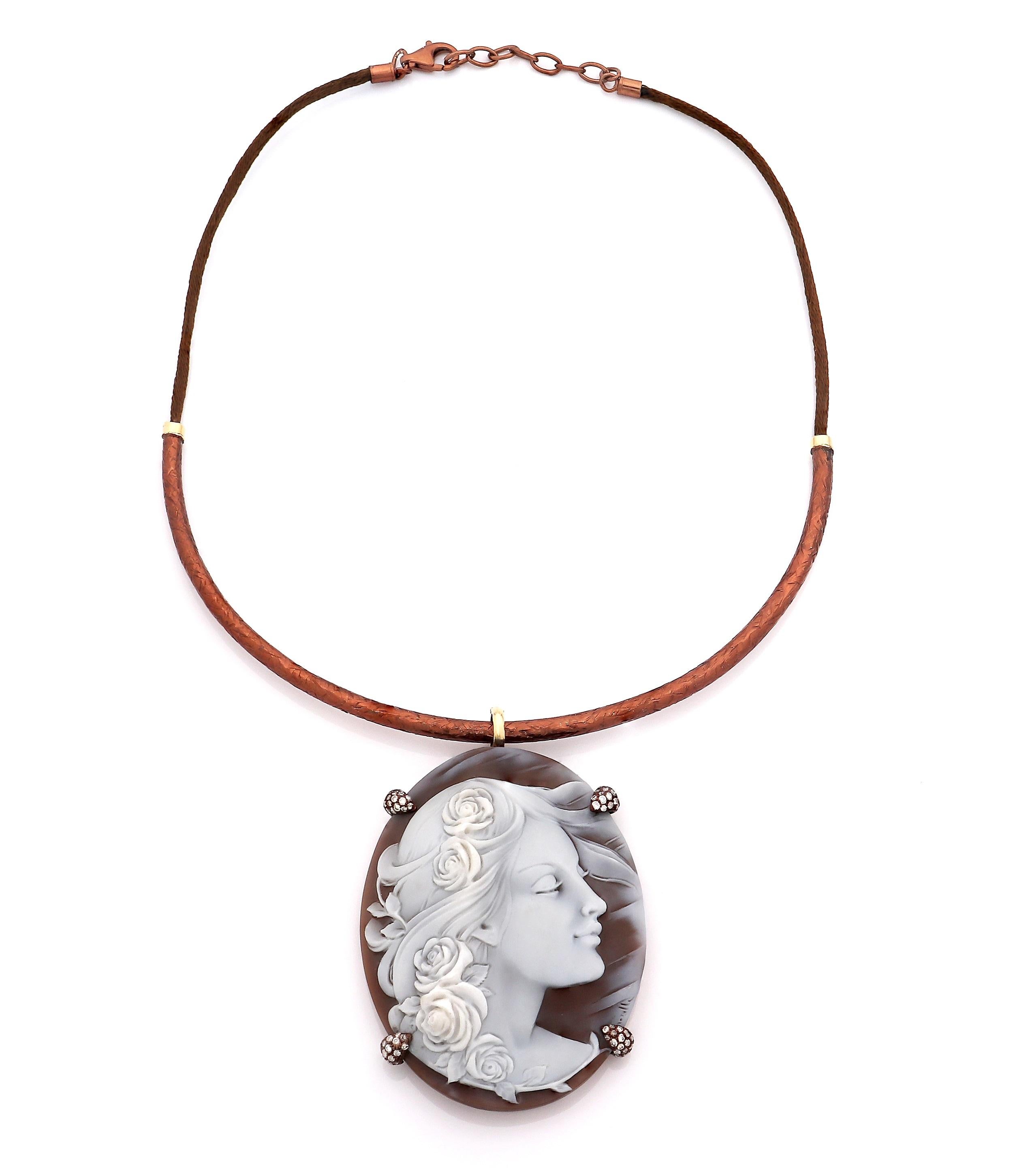 67mm sardonyx shell cameo hand-carved, on 18kt gold and sterling silver, with white diamonds 0.80ct
Length: 18