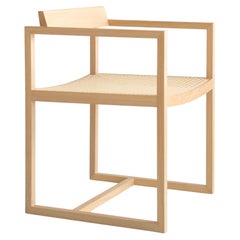 Sillón "Amélia" de madera de tauari y caña