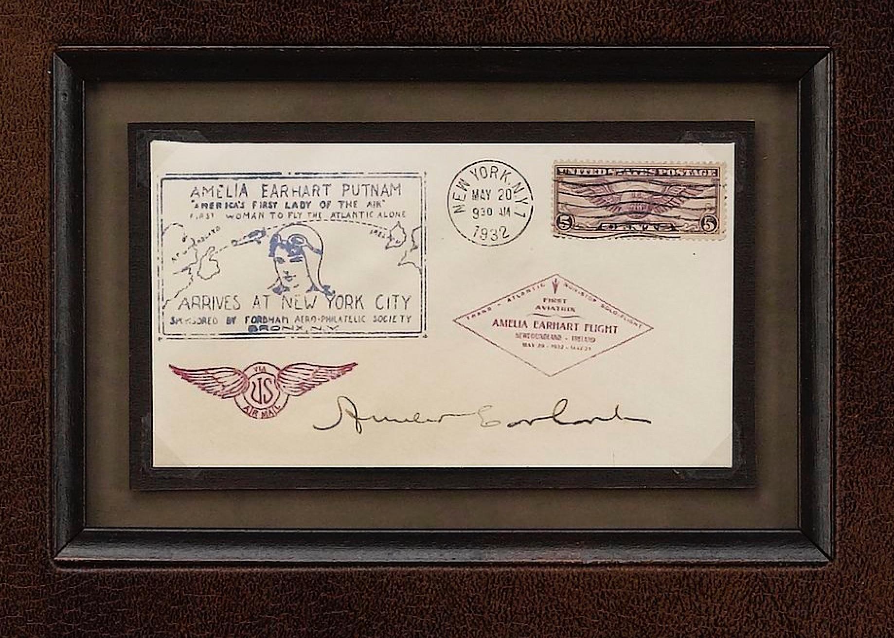 This is a custom collage featuring a first day Postal Cover signed by Amelia Earhart. The collage celebrates Earhart's famous transatlantic journey. The first day cover is dated May 20, 1932 in New York and autographed by Amelia Earhart with full