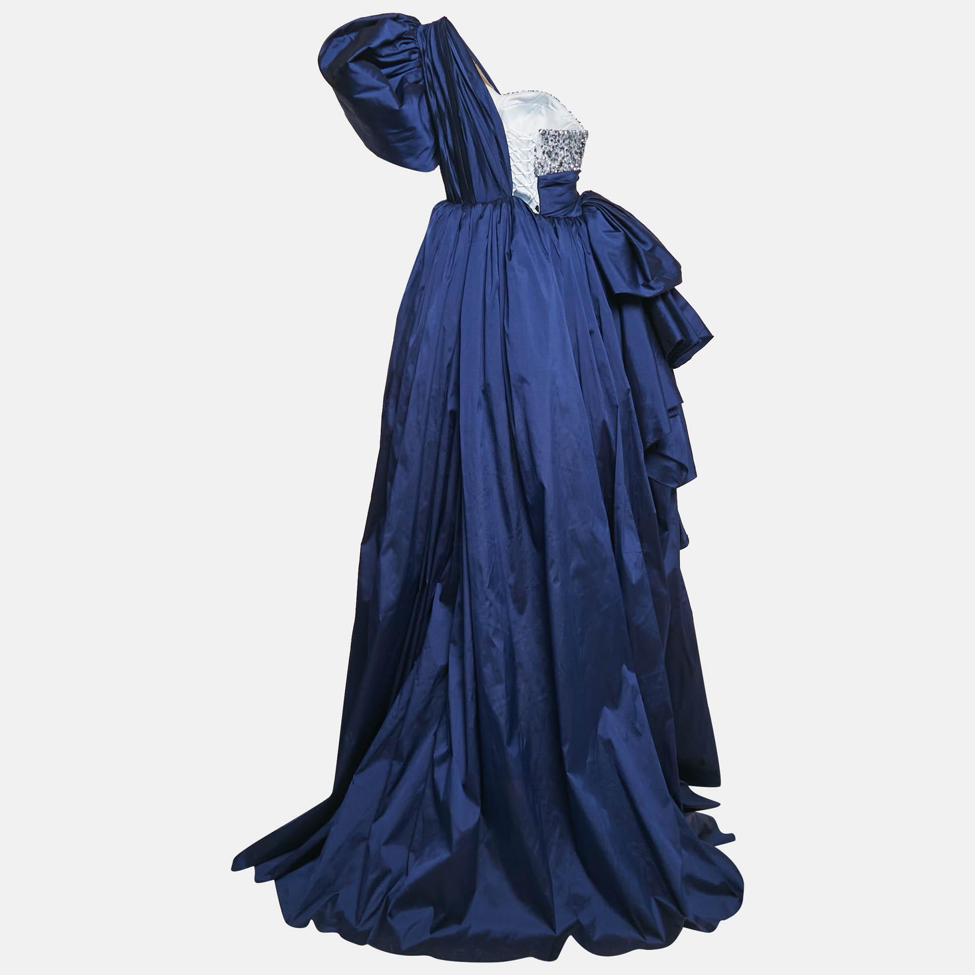 Resplendent elegant and gorgeous this gown defines it all. Flaunting a floor length silhouette this gown is beautified using stunning details and a stylish neckline. Wear it with statement accessories and a defining clutch.
