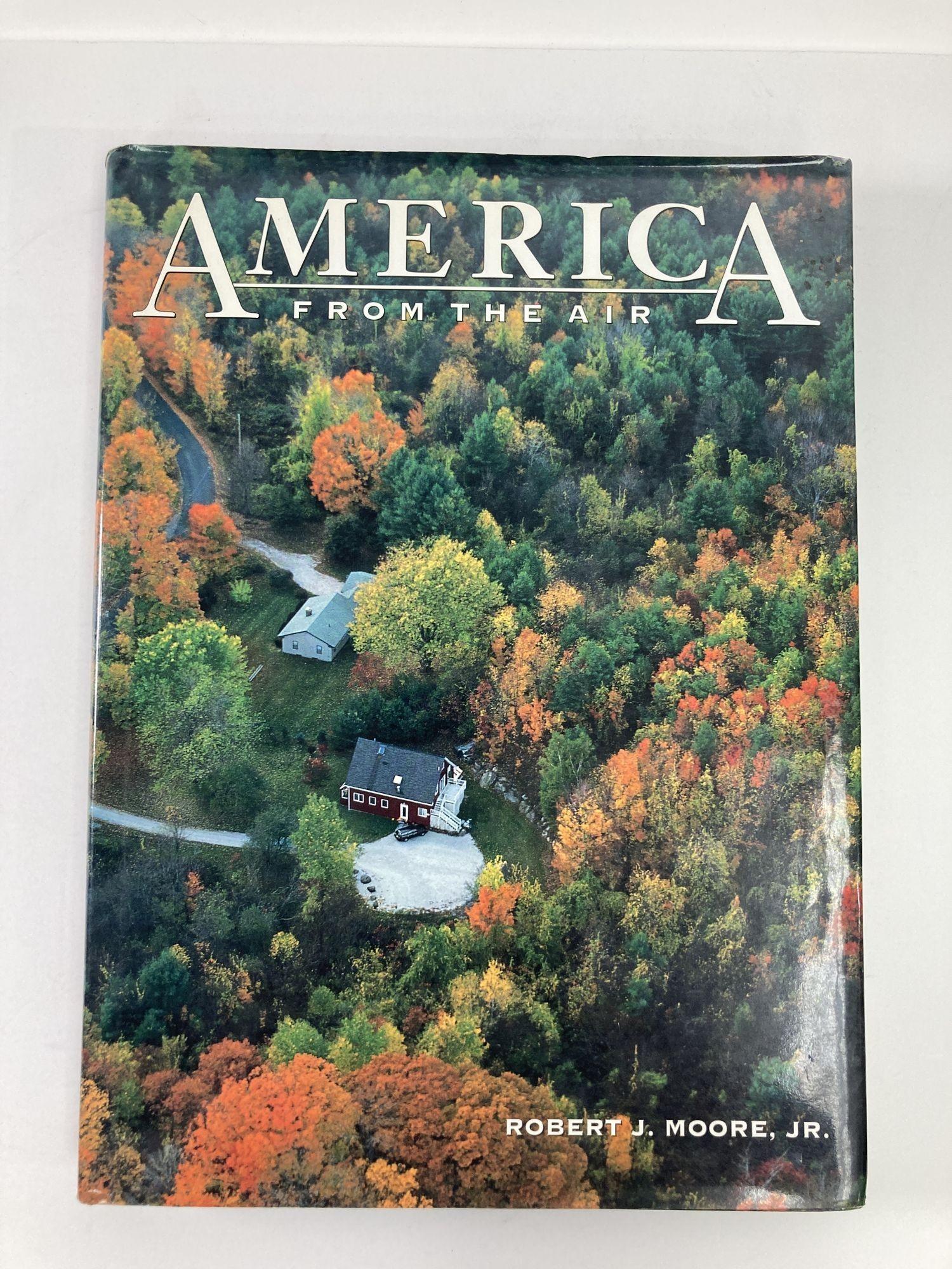 America from the Air by Robert J. Moore Laura Accomazzo Hardcover Book.
See the grandeur and variety of the American landscape from high above. Hundreds of oversized, spectacular photographs create a fascinating virtual tour of the 50 states from a