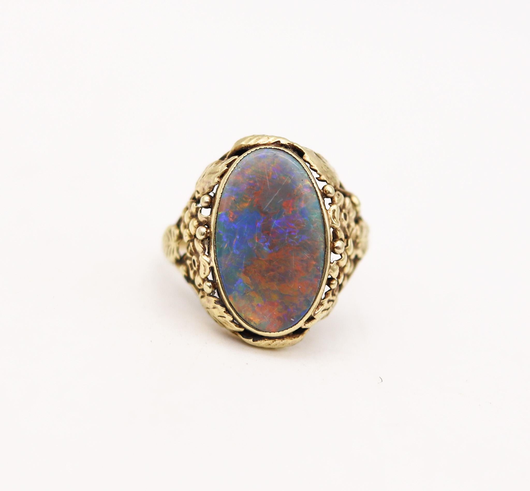 An art nouveau ring with Black opal.

A highly decorated ring, created in America during the art nouveau period, back in the 1895. This beautiful ring has been crafted with intricate organic motifs of leaves and grapes in yellow gold of 14 karats