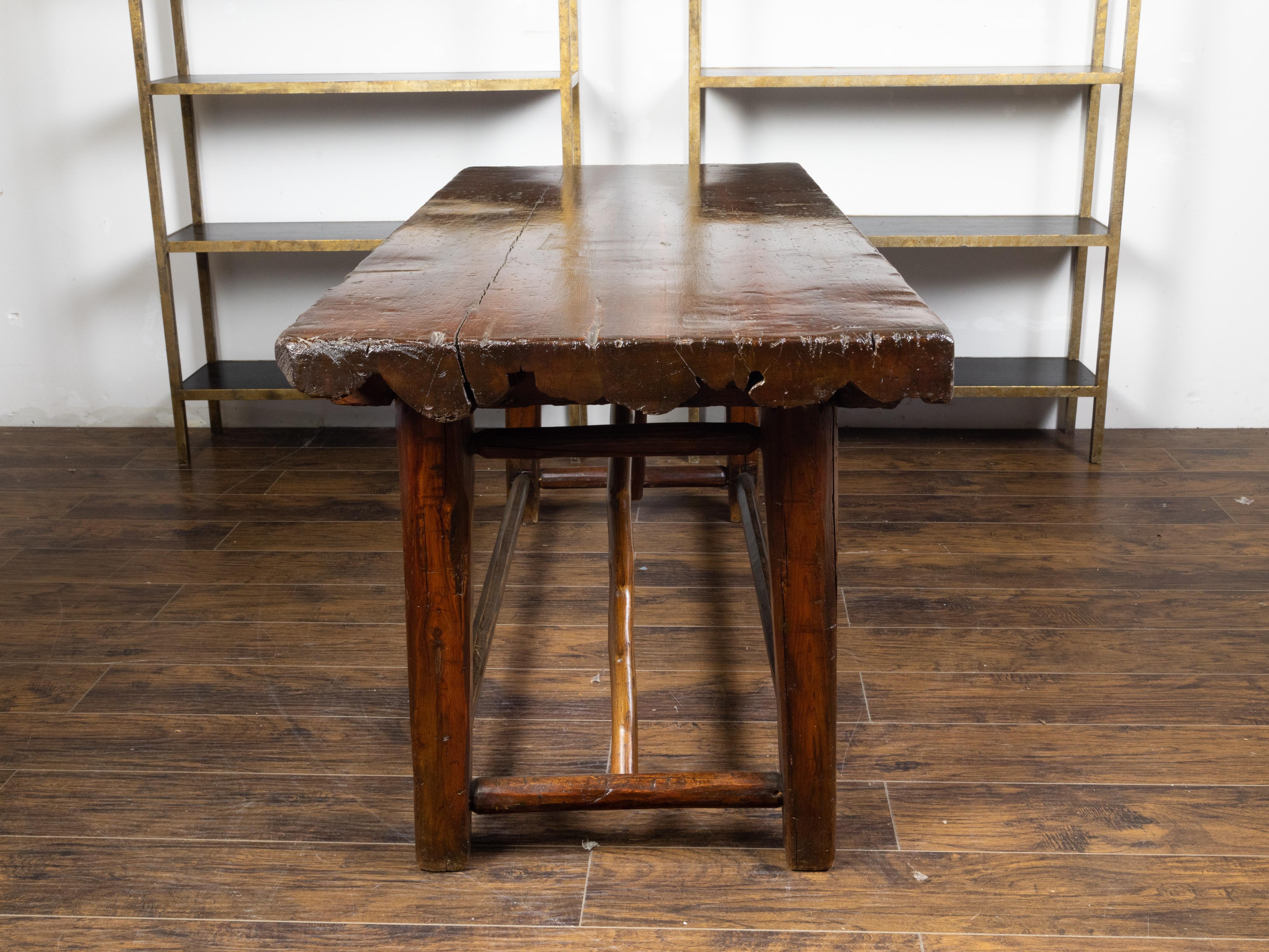 20th Century American 1900s Rustic Pine Log Table with Straight Legs and Side Stretchers For Sale