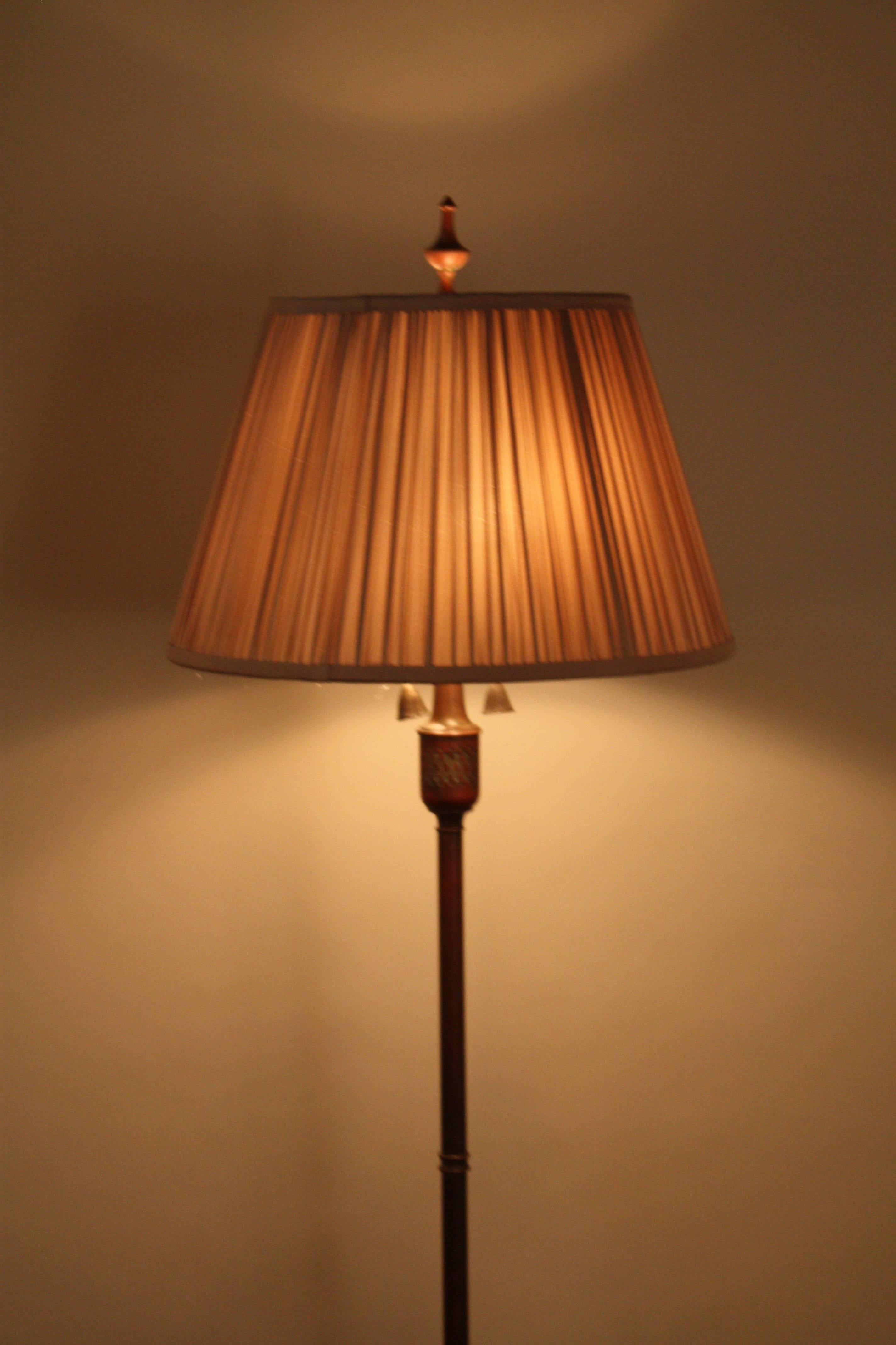 Elegant double light in brown bronze with touch of green color floor lamp.
Fitted with mushroom pleat lampshade.