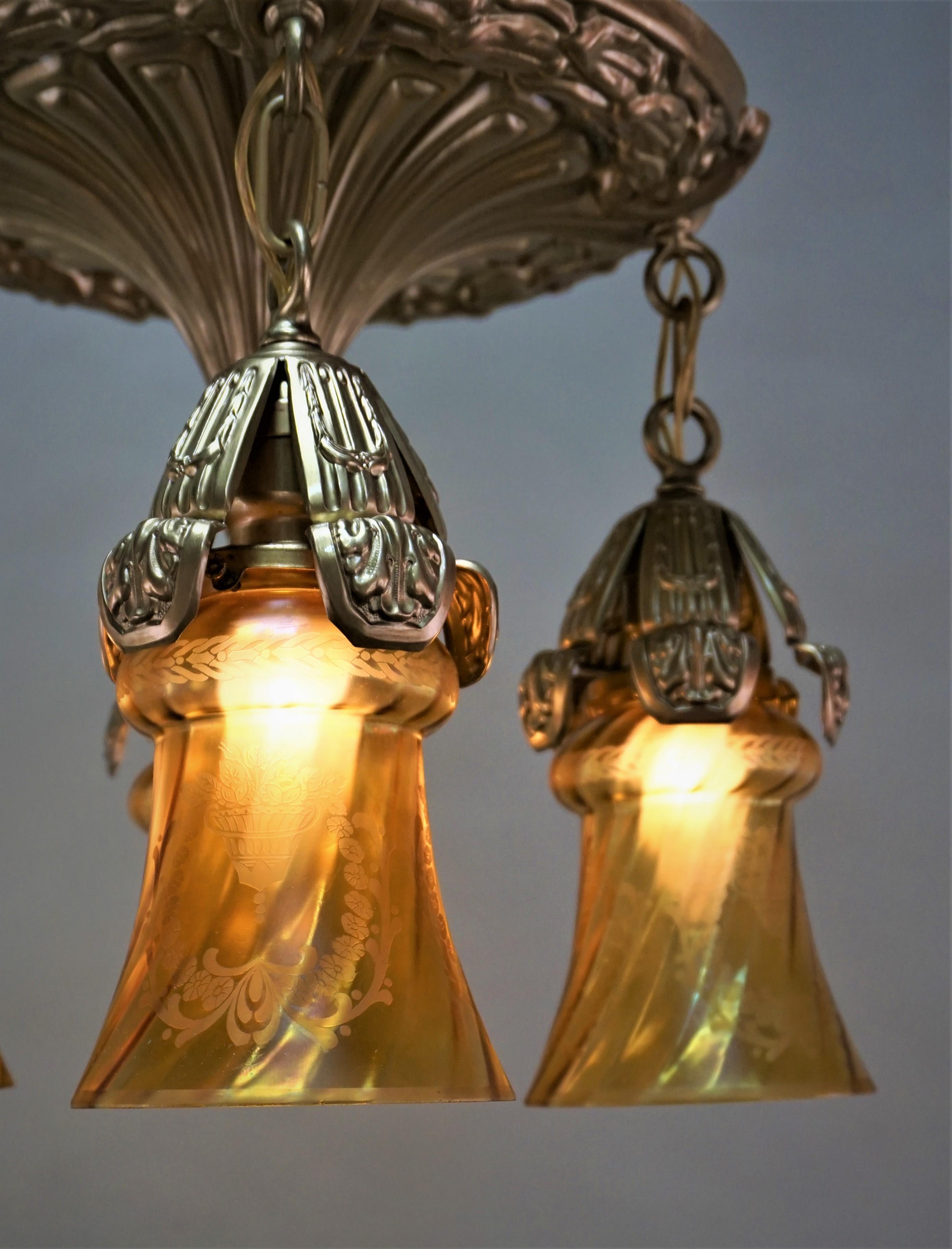 American 1920s brass chandelier with etched glass shades.
