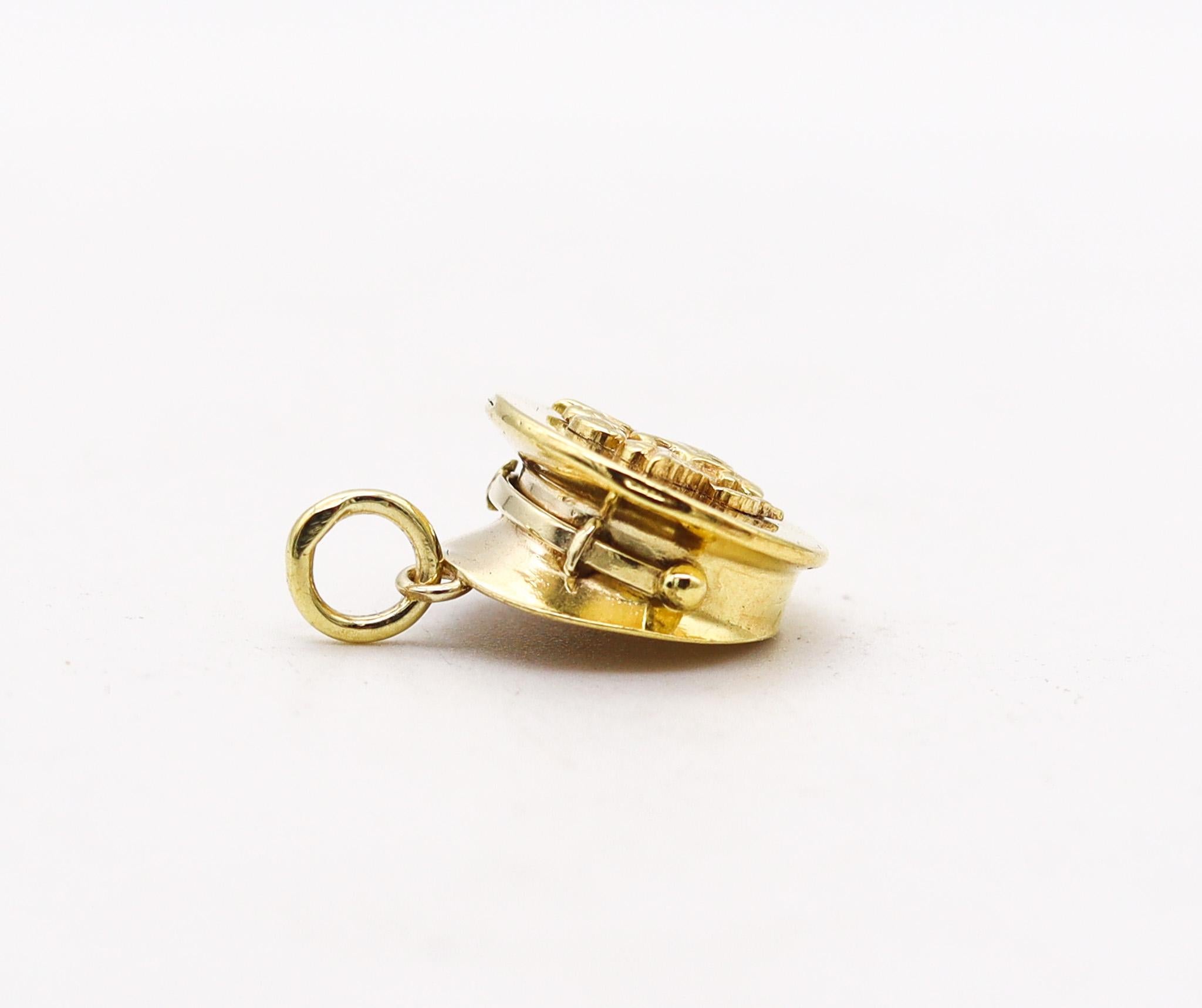 An American charm from the deco-retro period.

Here and in the following six lots, we are presenting an amazing selection of vintage charms for bracelets. This charm was made in America during the late art deco and the retro periods, before and