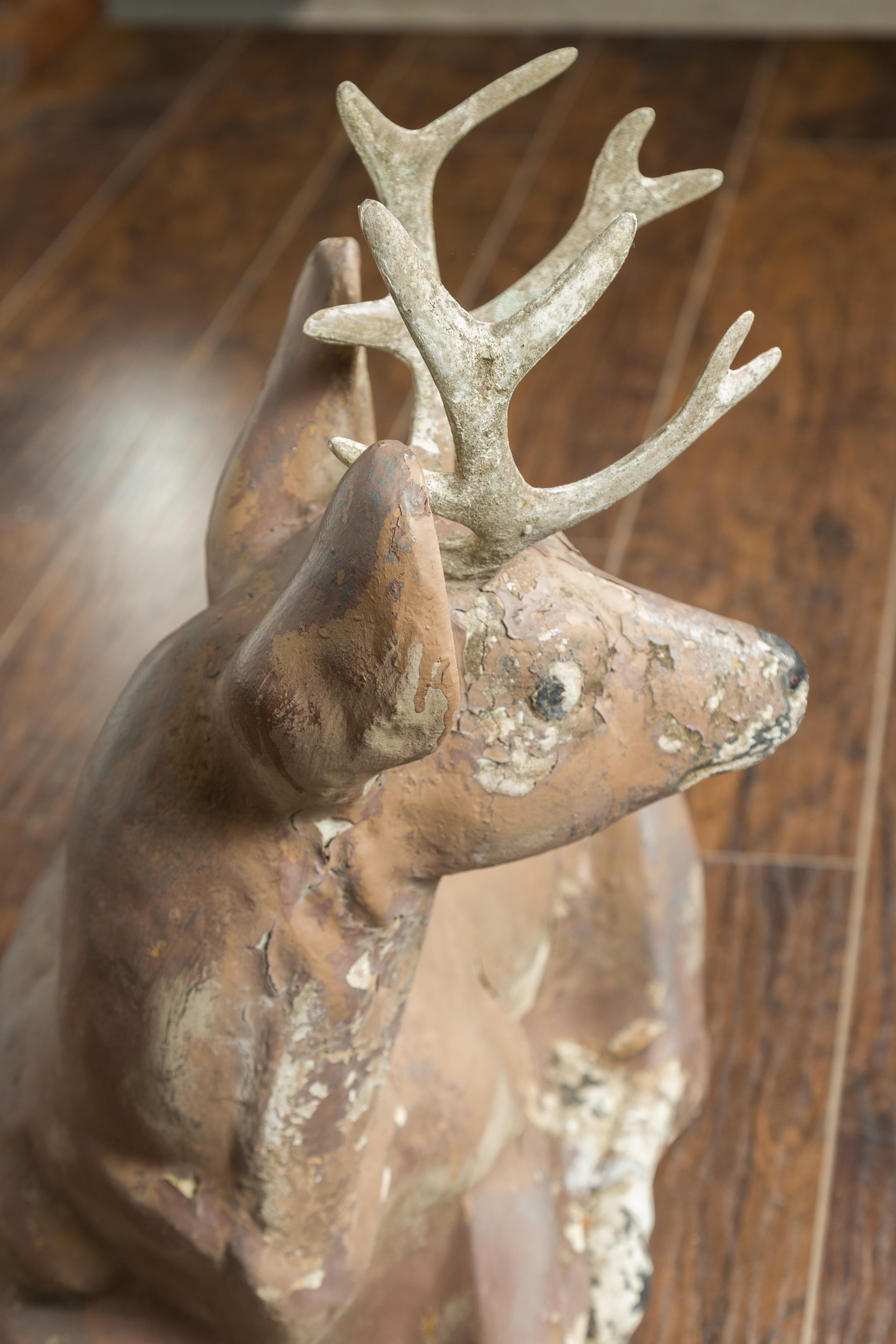 20th Century American 1950s Concrete Reclining Deer with Antlers and Weathered Appearance For Sale