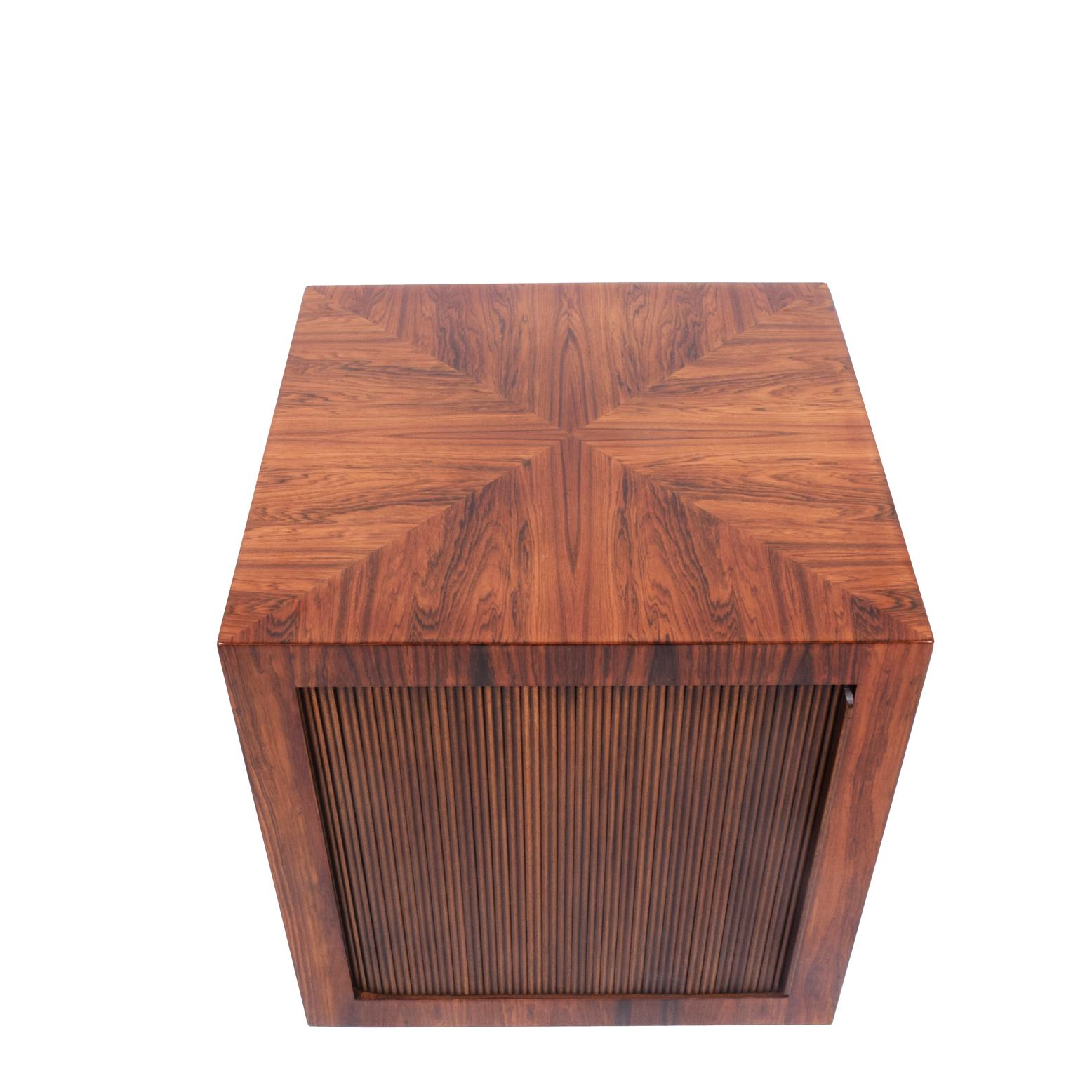 Brazilian rosewood bar cube on wheels with tambour door. Design number stamped on the bottom.