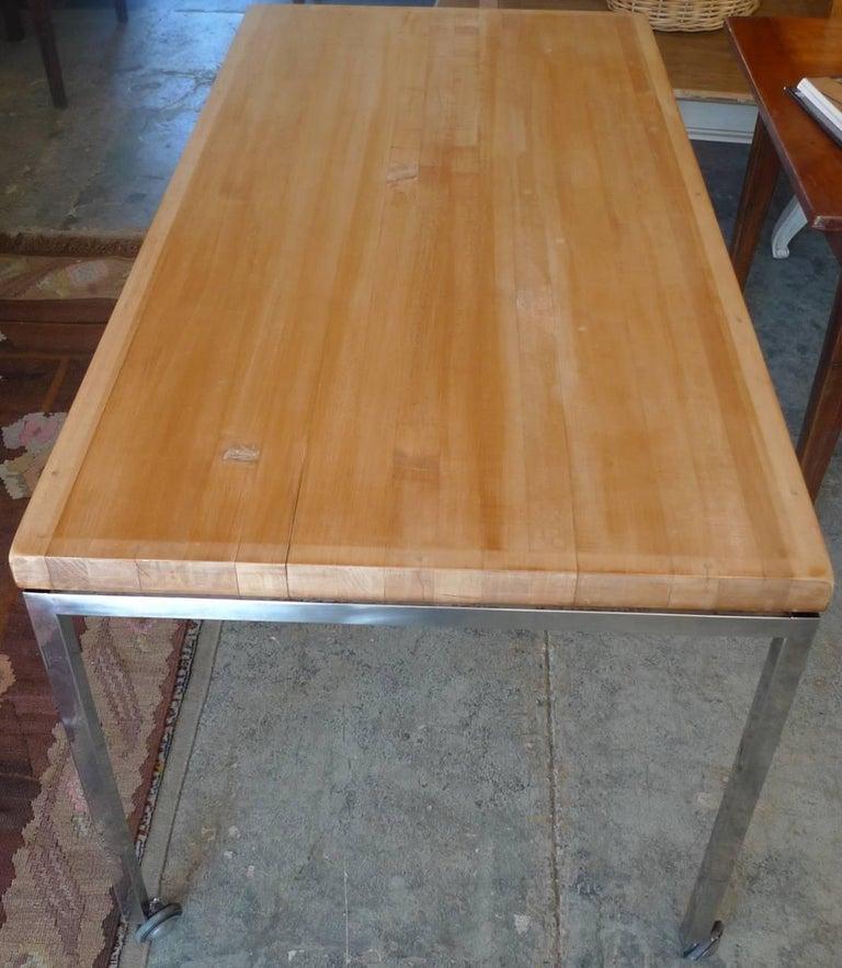 American 1970s butcher's block kitchen table on polished chrome legs and wheels.