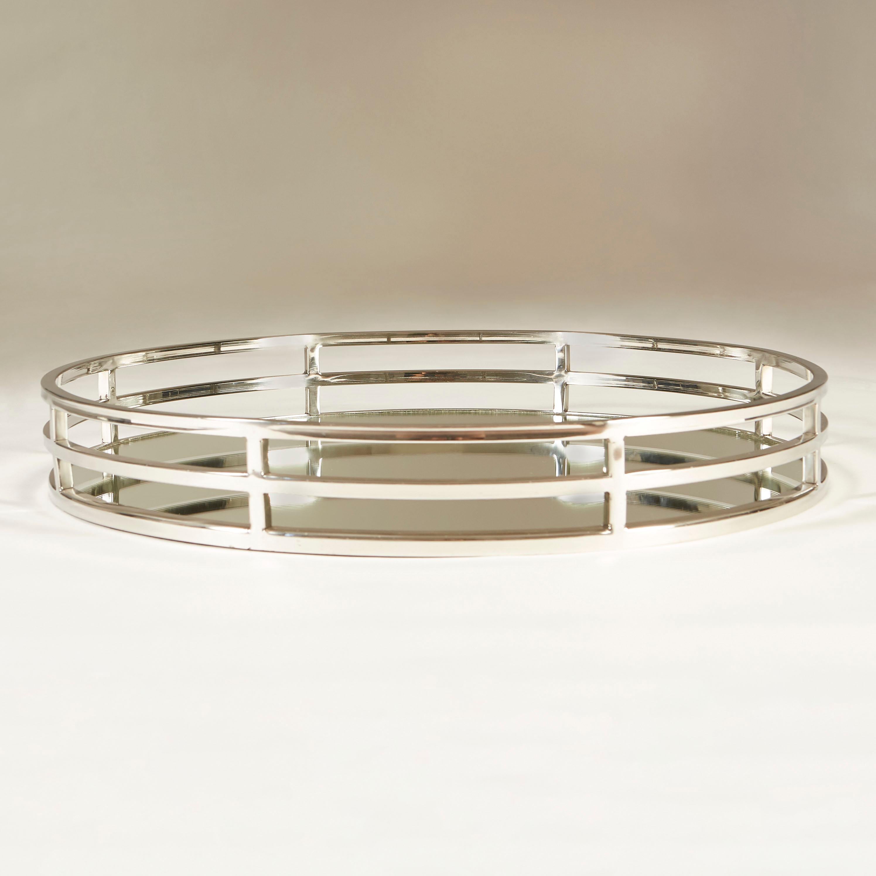 Substantial serving tray with three tiered decorative chrome surround and reflective mirrored base.