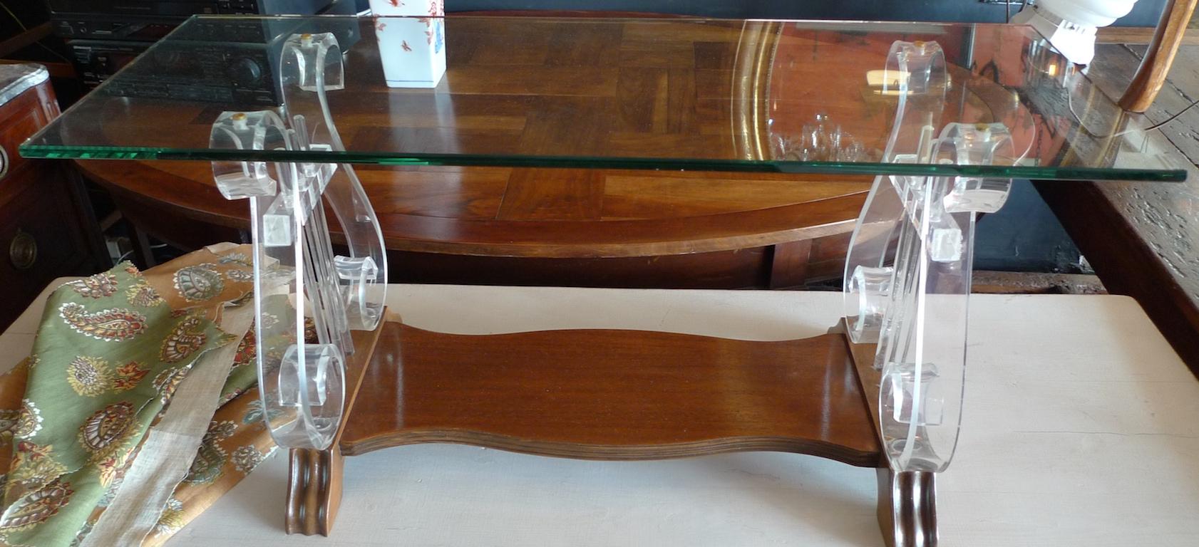 American 1970s glass top coffee table with lucite supports and walnut shelf.
 
