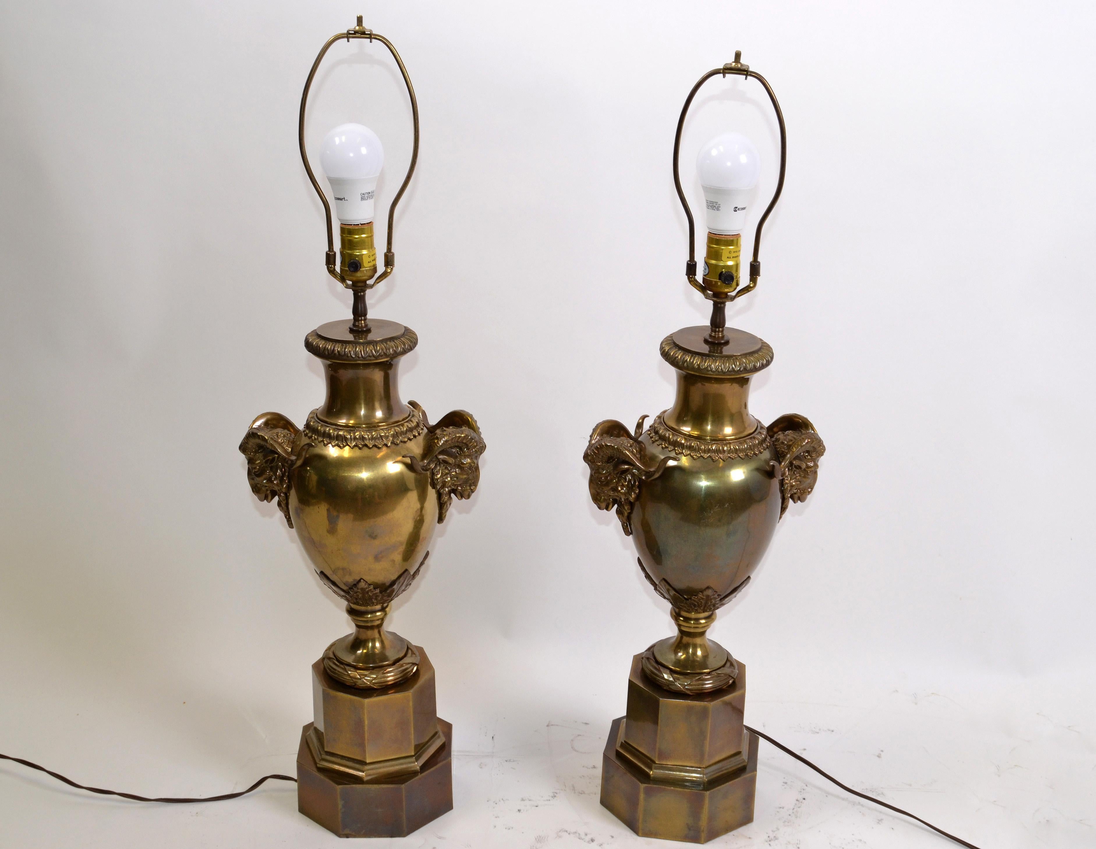 We offer a pair of American 1972 Chapman Iconic, Art Deco ram's head bronze urn table lamps.
The curvaceous part of the lamp is well defined by the ram's head draped, on either end, trophy-like in proportion, as they can be handled or held from
