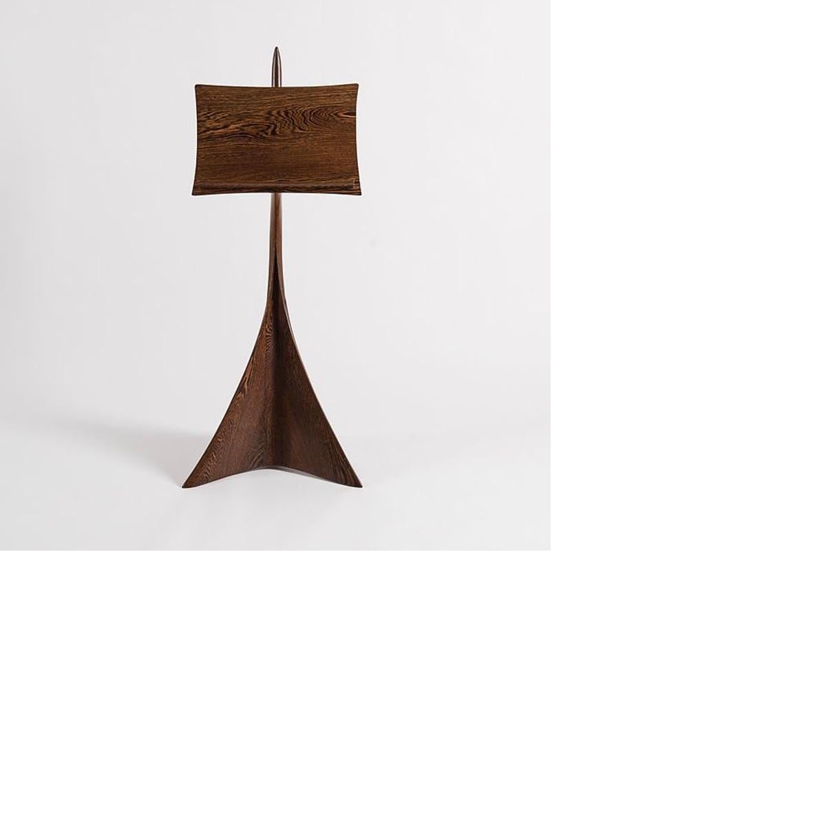 An American carved wood music stand by Michael Coffey. This piece represents an evolution in sculptor Michael Coffey's process. Always seeking functionality and beauty in his designs, Coffey attempted perfection in the adjusting mechanism on this