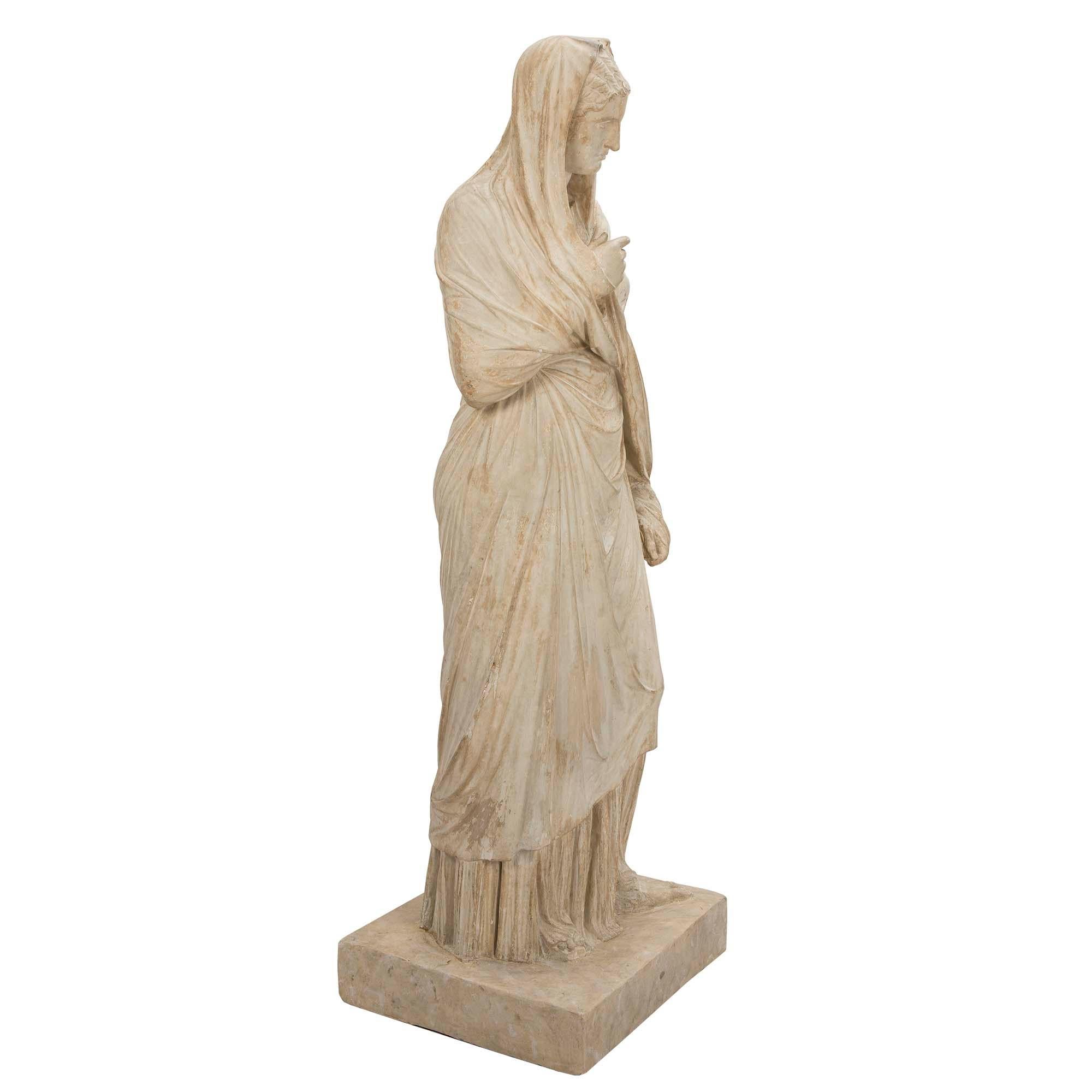 A most elegant American 19th century plaster statue of a classical maiden signed PP Caproni & Bro. Boston. The beautiful maiden is raised by a square base and is draped in wonderfully executed classical attire. Fabulous detail in the creases and